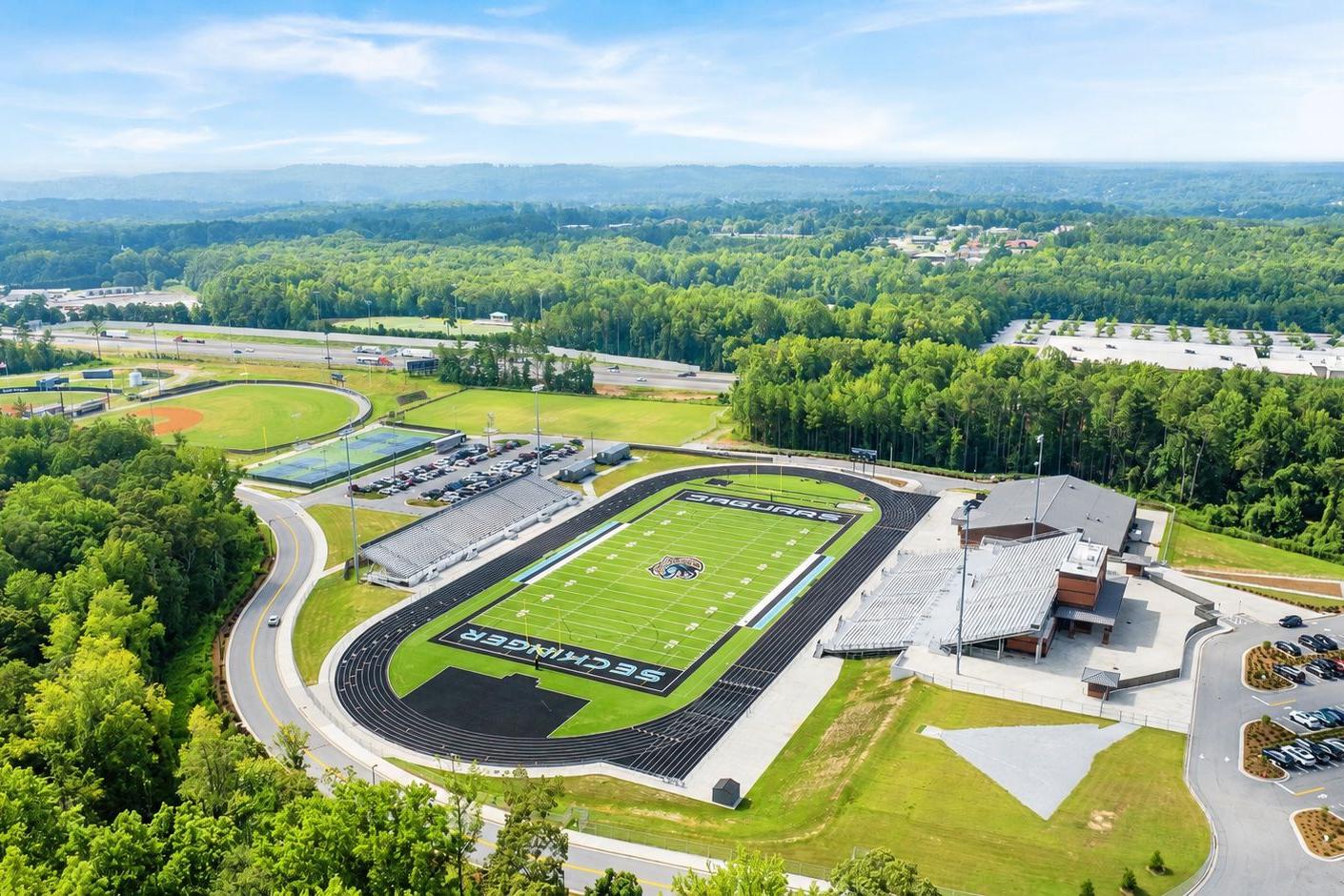 Aerial view of Seckinger High School stadium near Fern Hollow in Buford, Georgia, built by Davidson Homes.