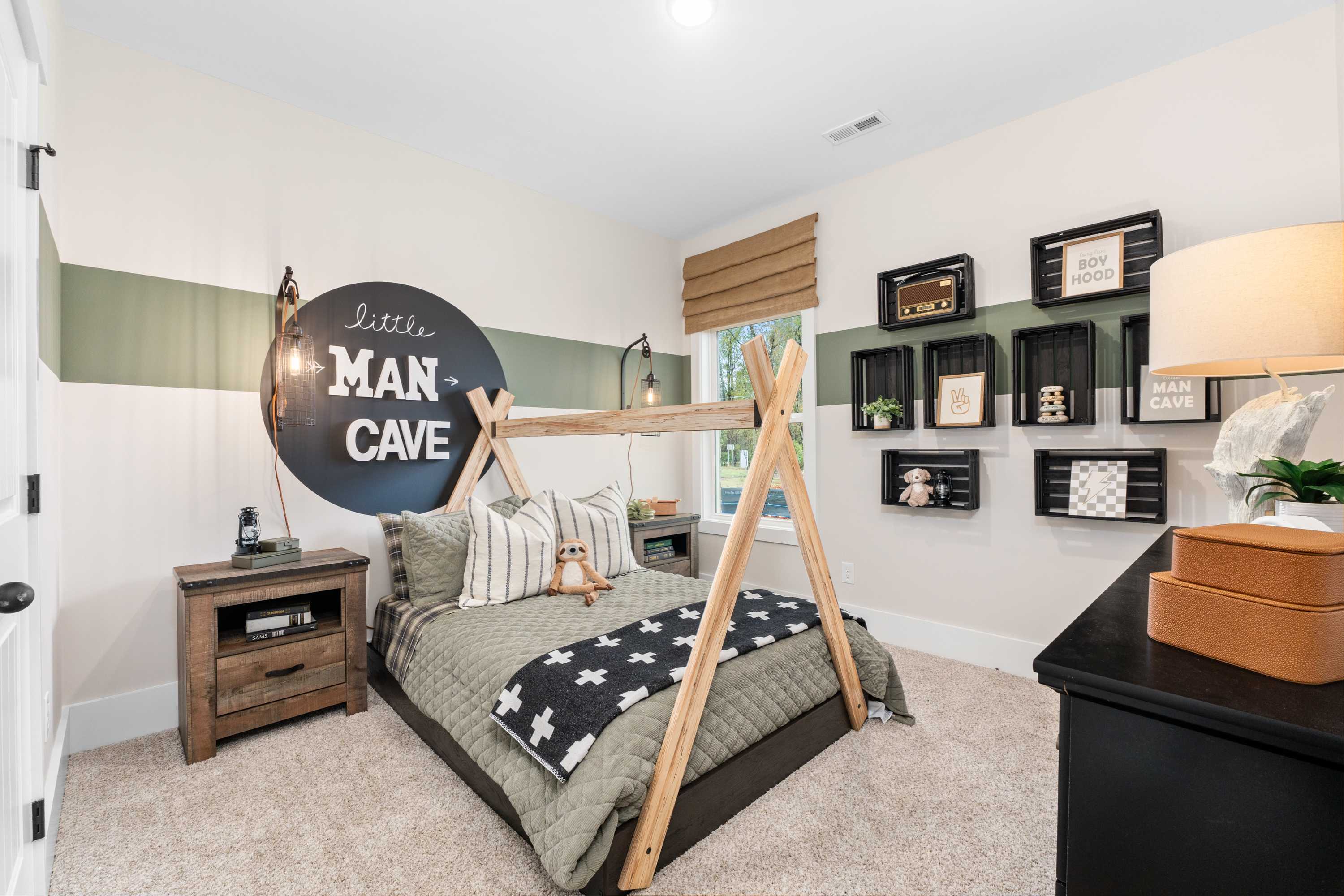 Boy's little man cave bedroom in Spragins Cove Huntsville AL with teepee bed, rustic shelves, and star bedding