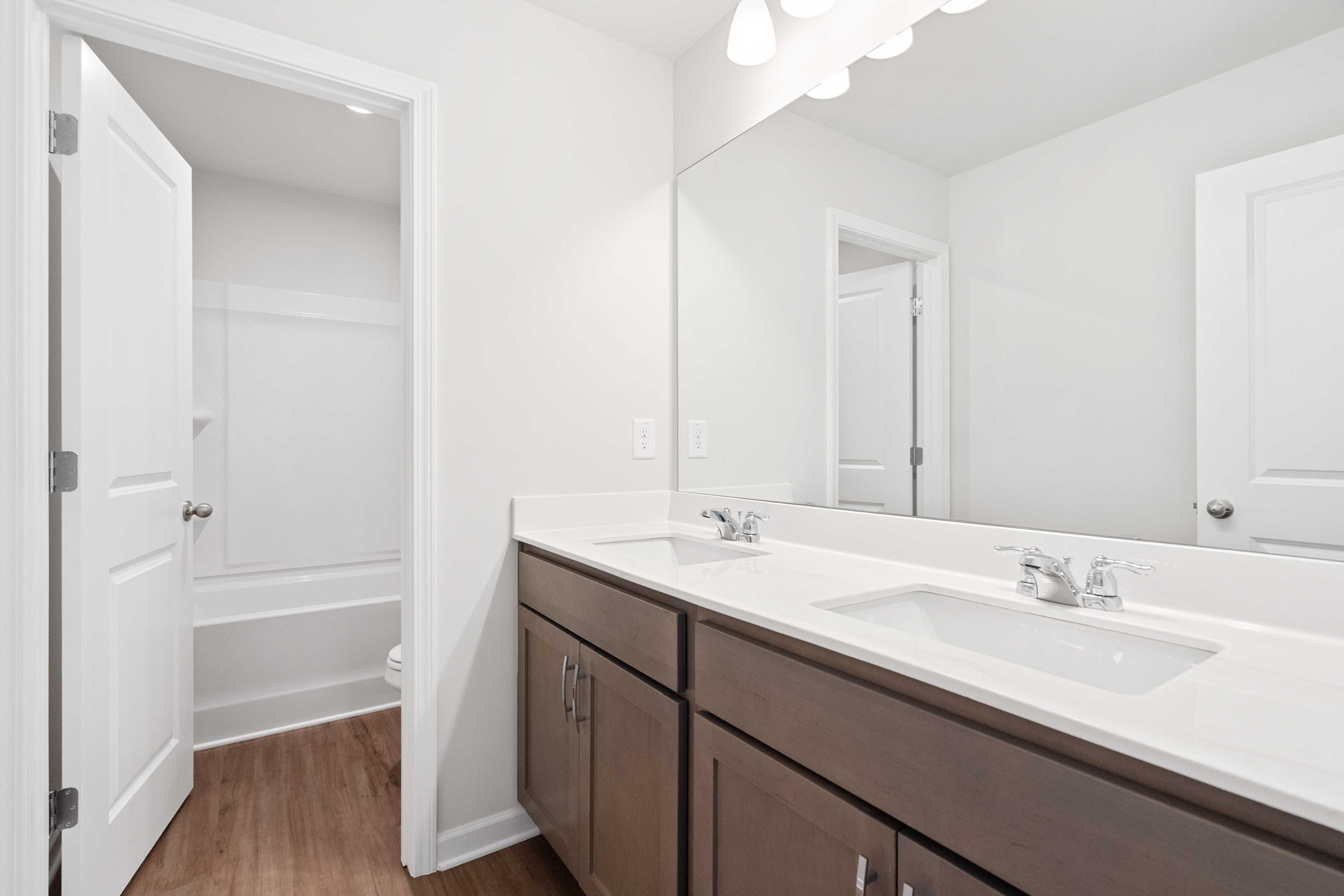 Spacious modern bathroom at Mountainbrook in Cartersville Georgia with double sink vanity and bathtub