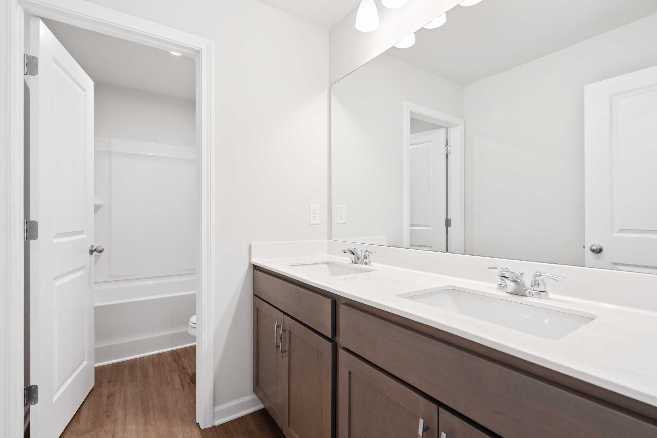 Spacious modern bathroom at Mountainbrook in Cartersville Georgia with double sink vanity and bathtub
