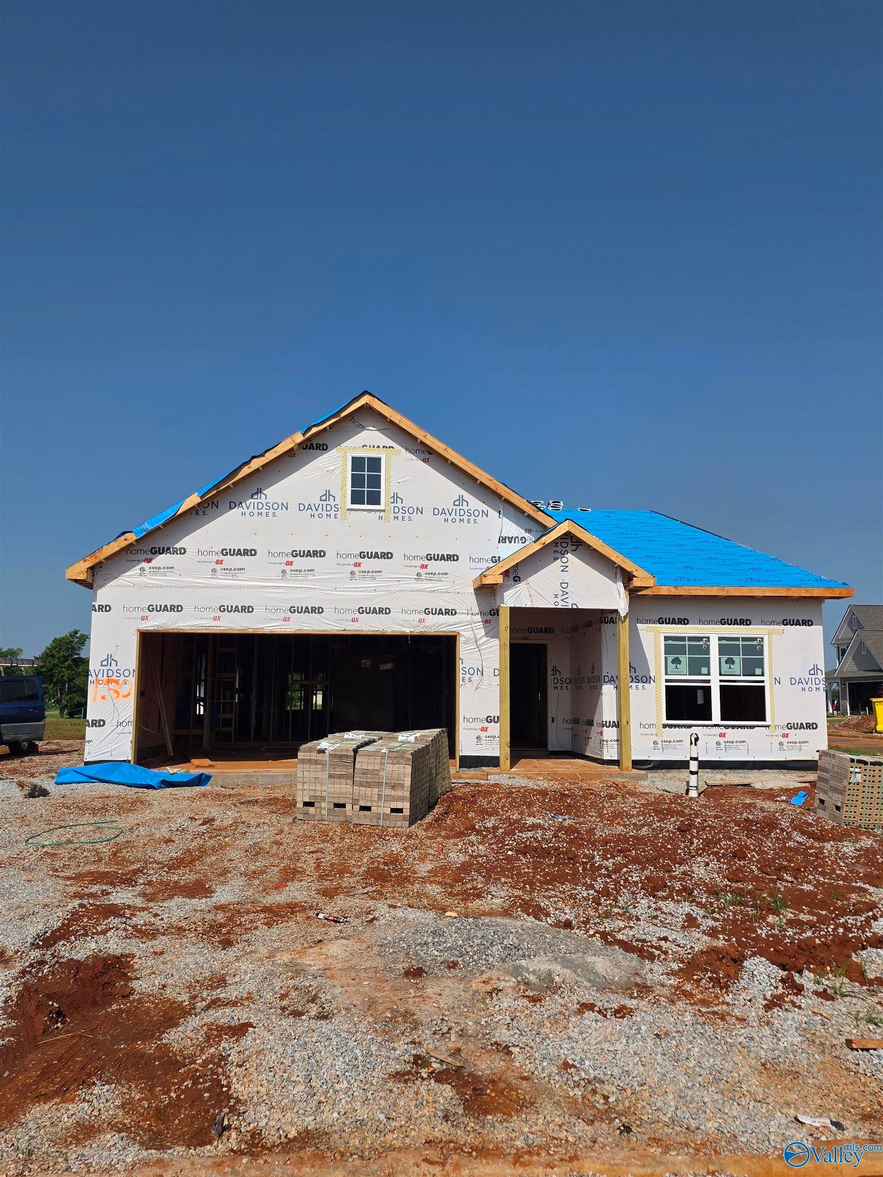 The Everett C floor plan under construction by Davidson Homes in Evergreen Mill, Madison, Alabama featuring 2-car garage.