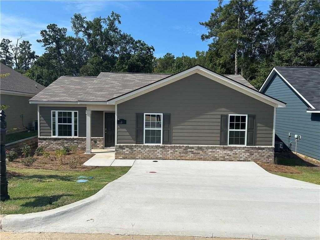 Modern gray single-story 3-bedroom home with brick accents, front porch, and driveway in Summer Vineyard, Phenix City, Alabama by Davidson Homes