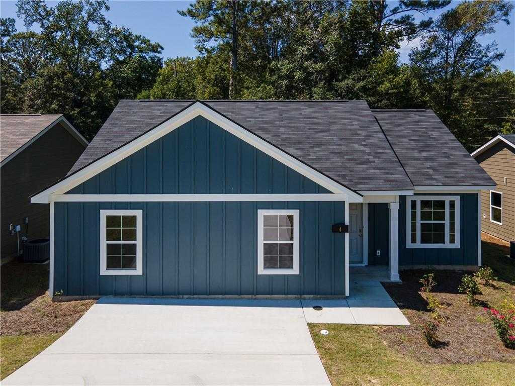 Navy blue 1-story 3-bedroom home with white trim, gabled roof, driveway, and landscaping in Summer Vineyard, Phenix City, Alabama