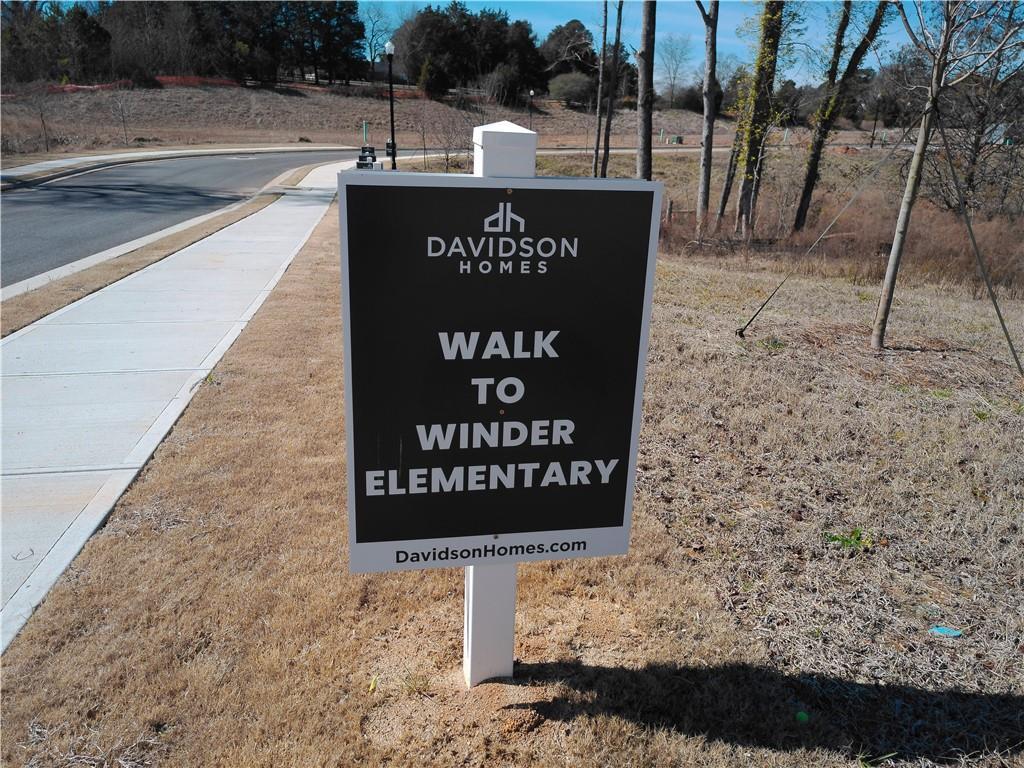 Davidson Homes sign highlighting walk to Winder Elementary in Lake Shore community, Winder, Georgia