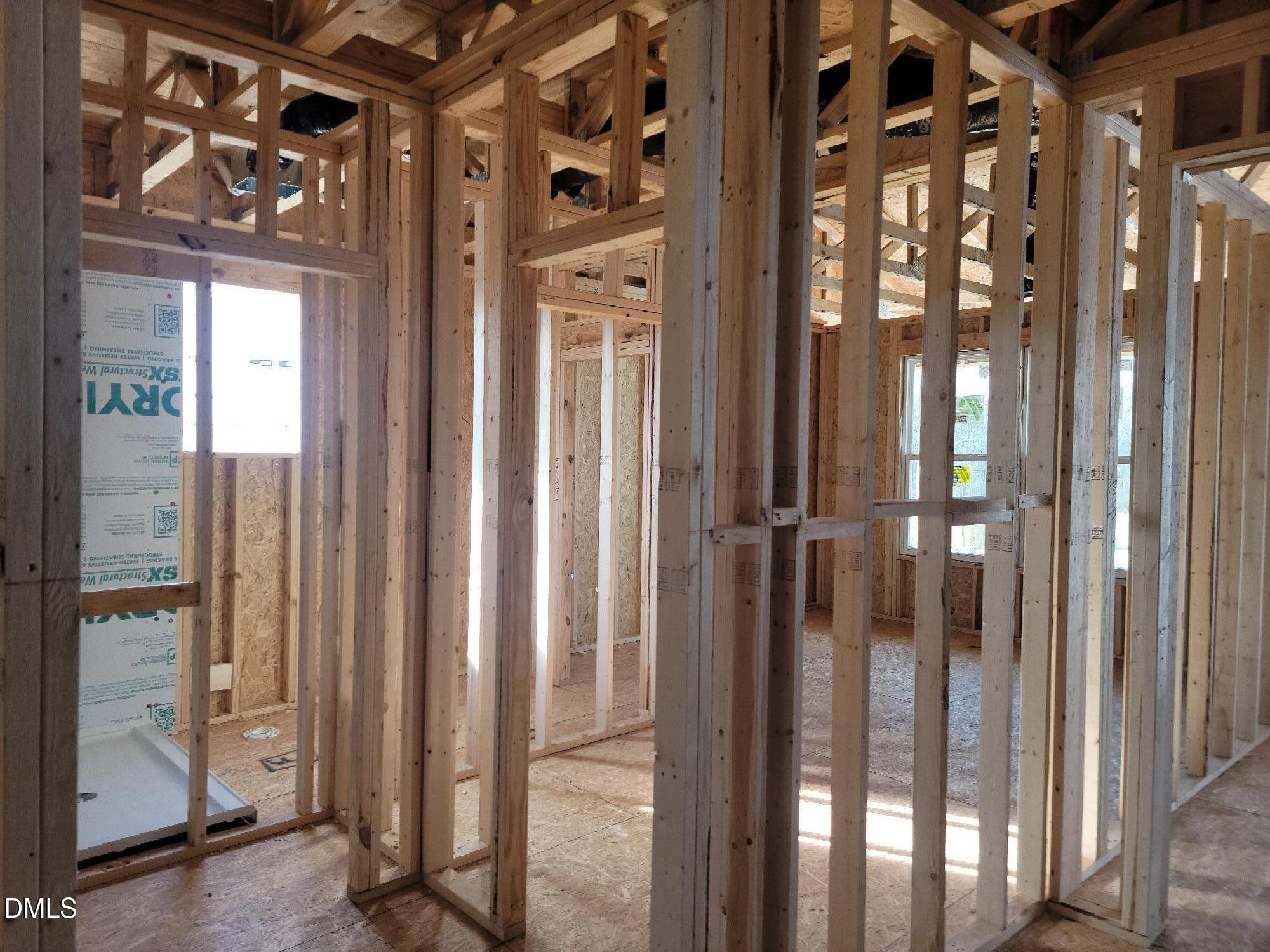 Framing stage interior of The Cypress B II 4-bedroom home by Davidson Homes, Tobacco Road, Angier, North Carolina