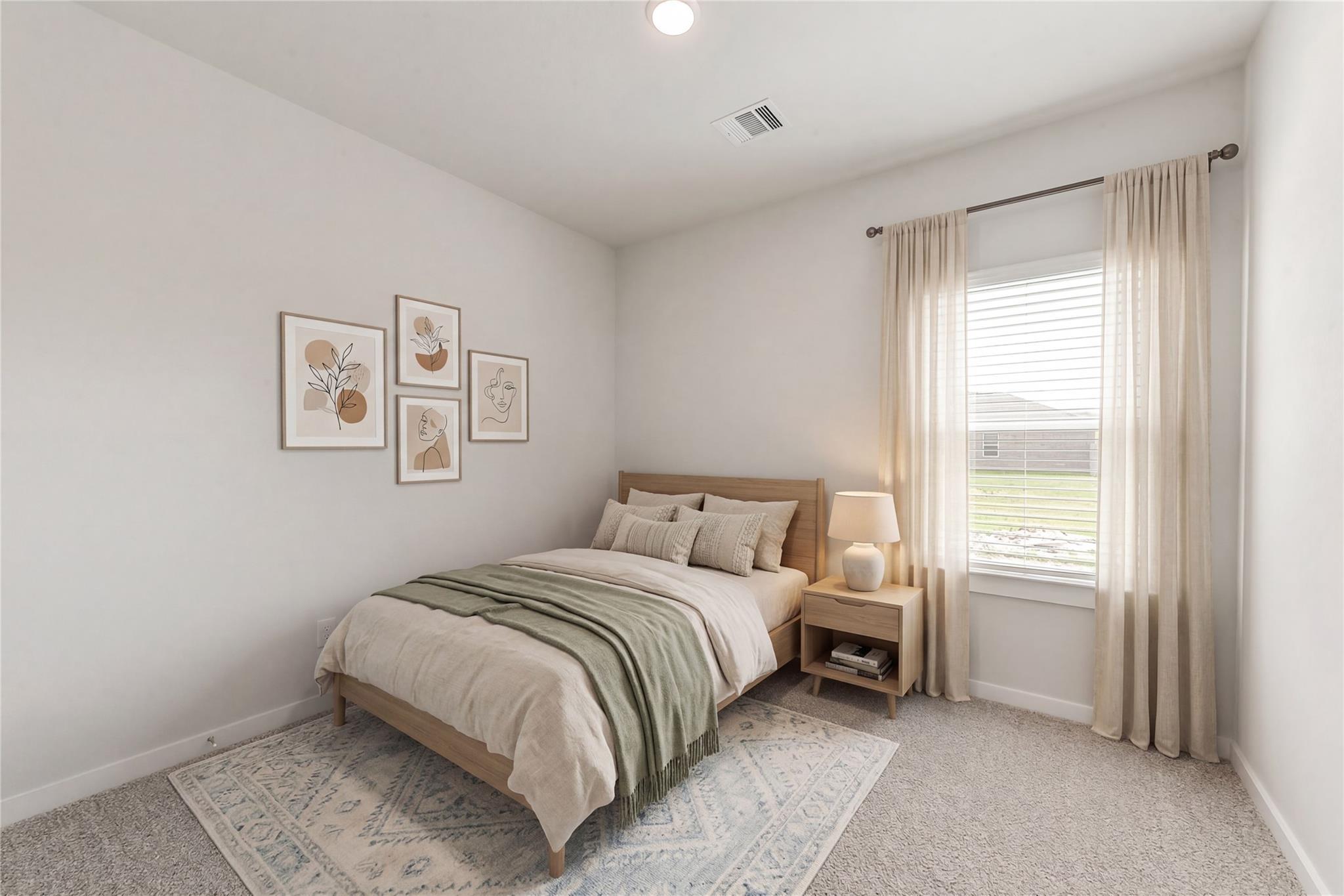 Cozy bedroom with wooden bed, beige linens, abstract wall art, and window view in The Frio G floor plan, Windmill Estates, Magnolia, Texas