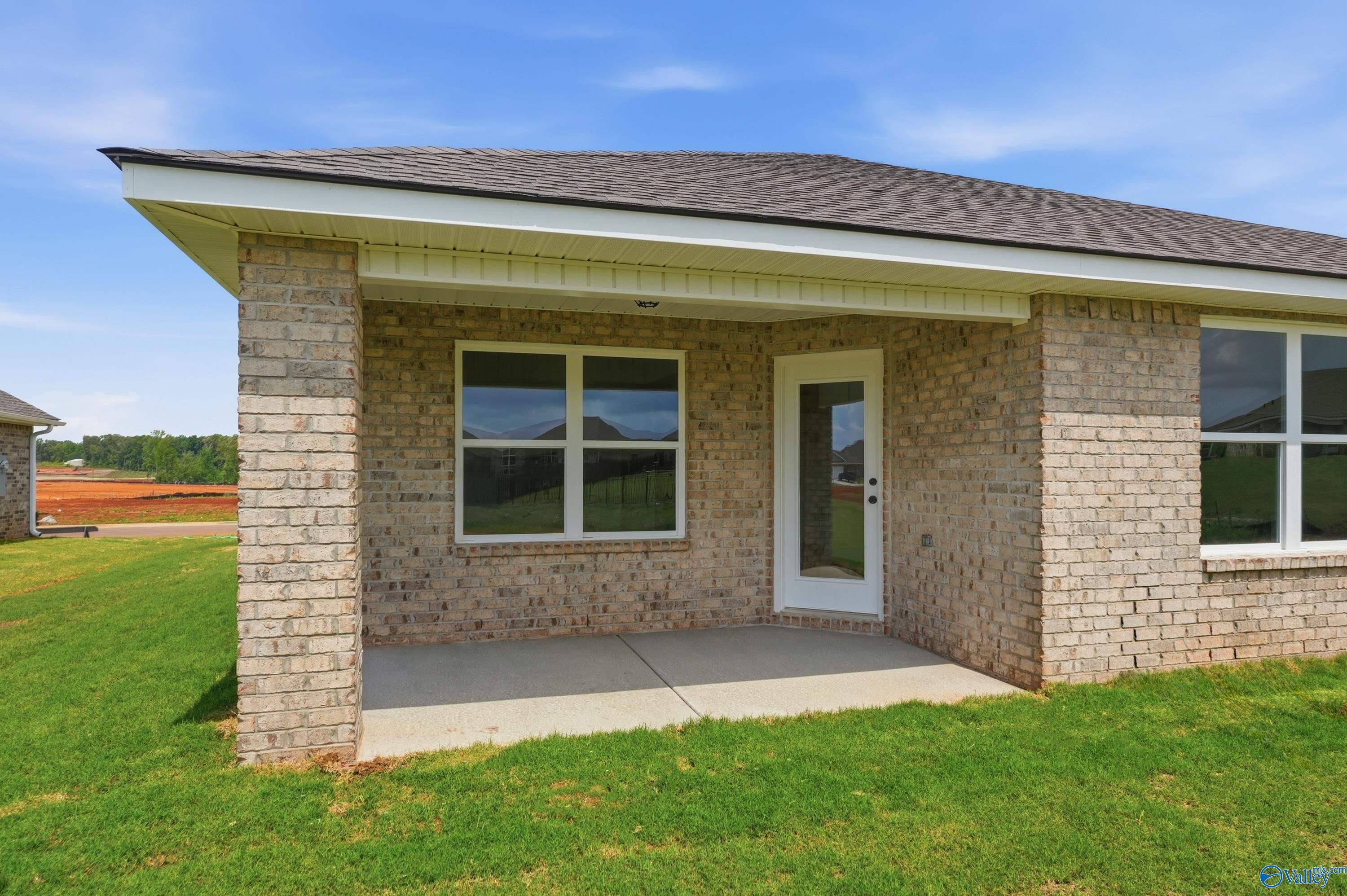 Covered back patio of The Franklin floor plan at Heritage Lakes in New Market, Alabama.