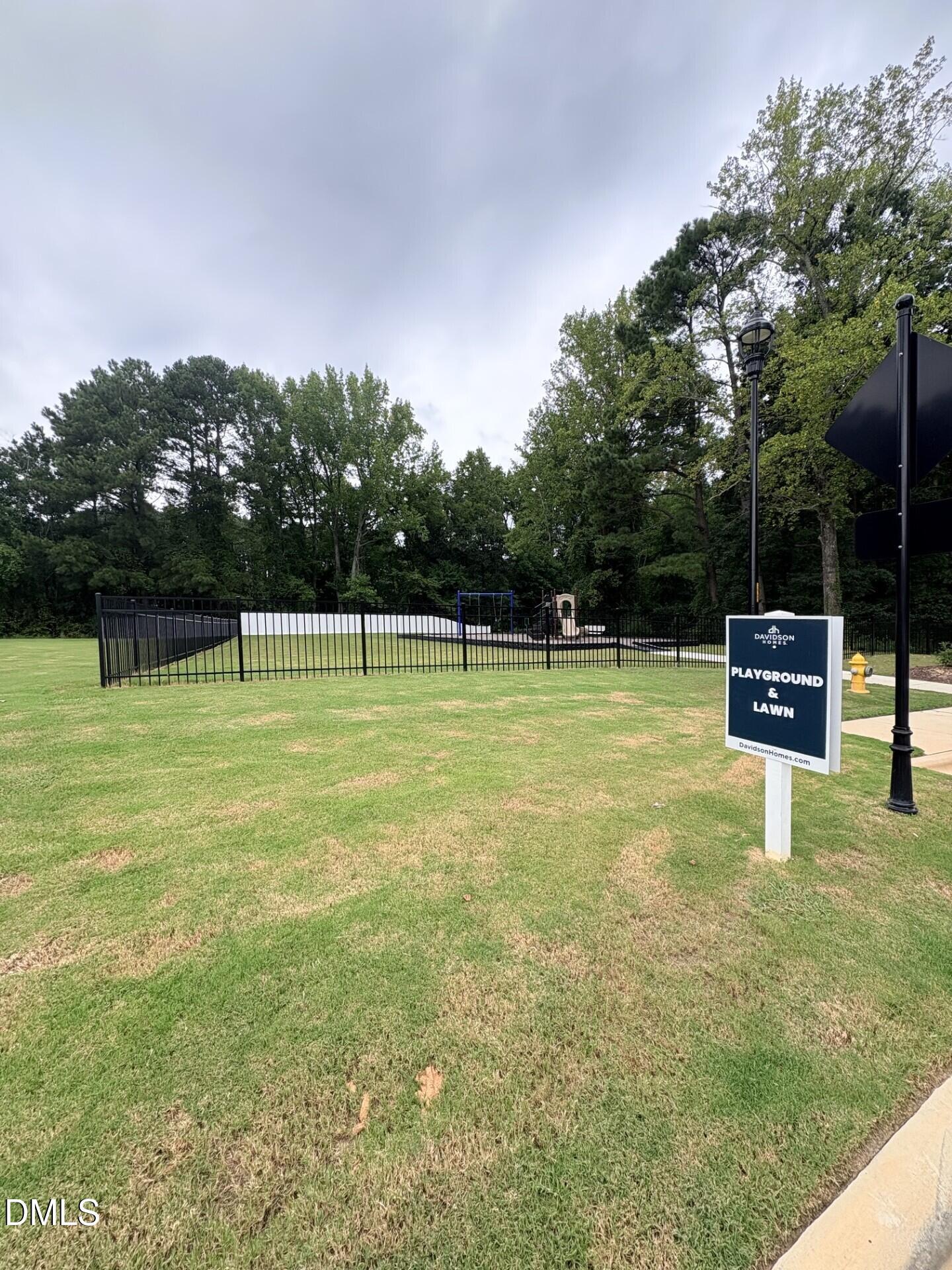Community playground and lawn area at Woodland Crossing by Davidson Homes in Zebulon, North Carolina.