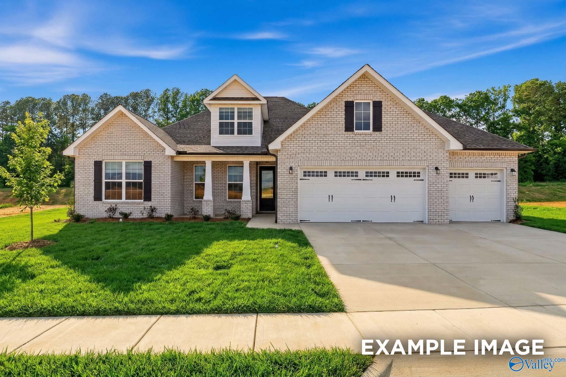 The Rockford floor plan by Davidson Homes features a 3-car garage, brick exterior, and 1.5 stories in Briercreek, AL.