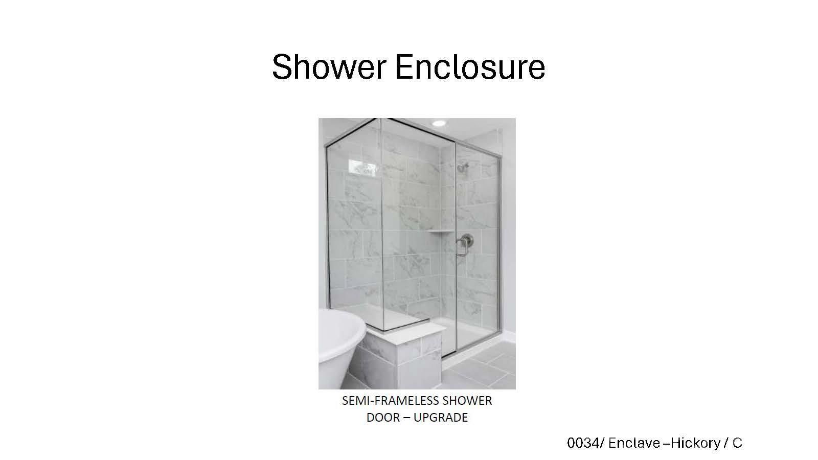 Semi-frameless glass shower enclosure upgrade with marble tile in The Hickory C II floor plan at Enclave at Belmont, NC