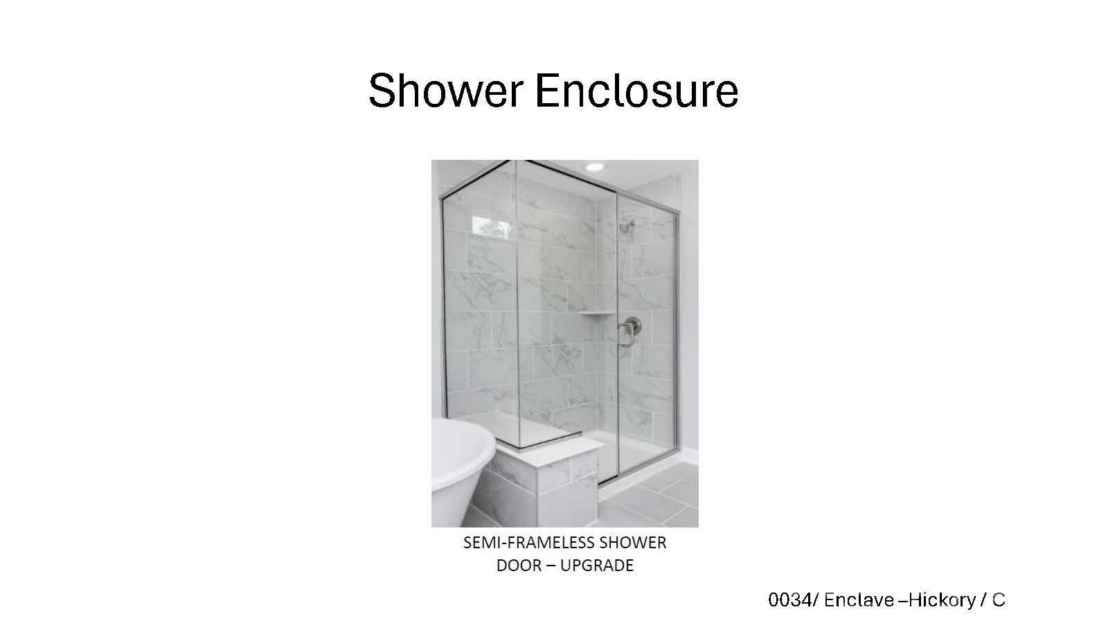 Semi-frameless glass shower enclosure upgrade with marble tile in The Hickory C II floor plan at Enclave at Belmont, NC