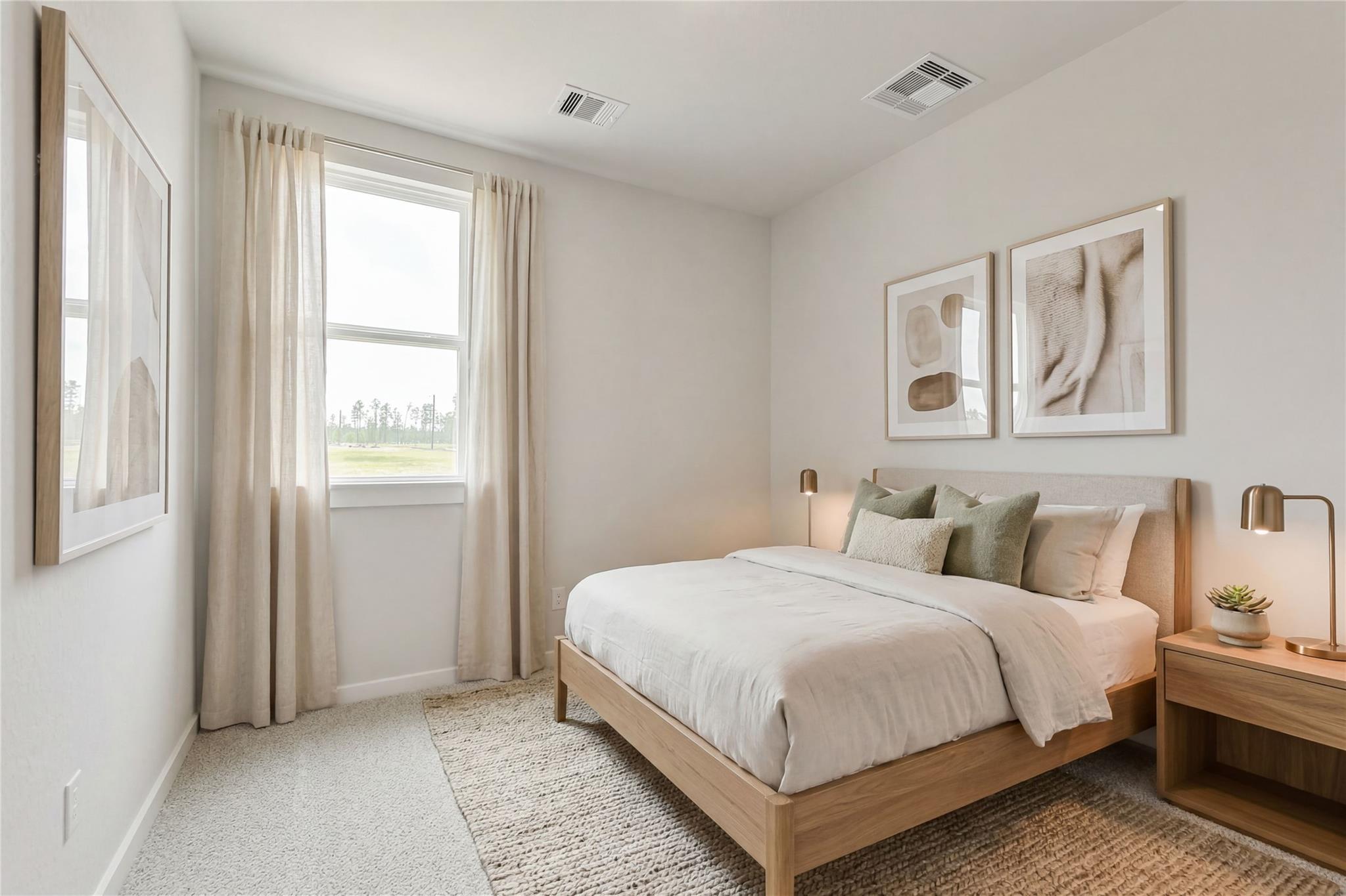 Serene bedroom with oak bed, neutral linens, sheer curtains on window overlooking pines, abstract art in Davidson Homes The Colorado G, Conroe, Texas