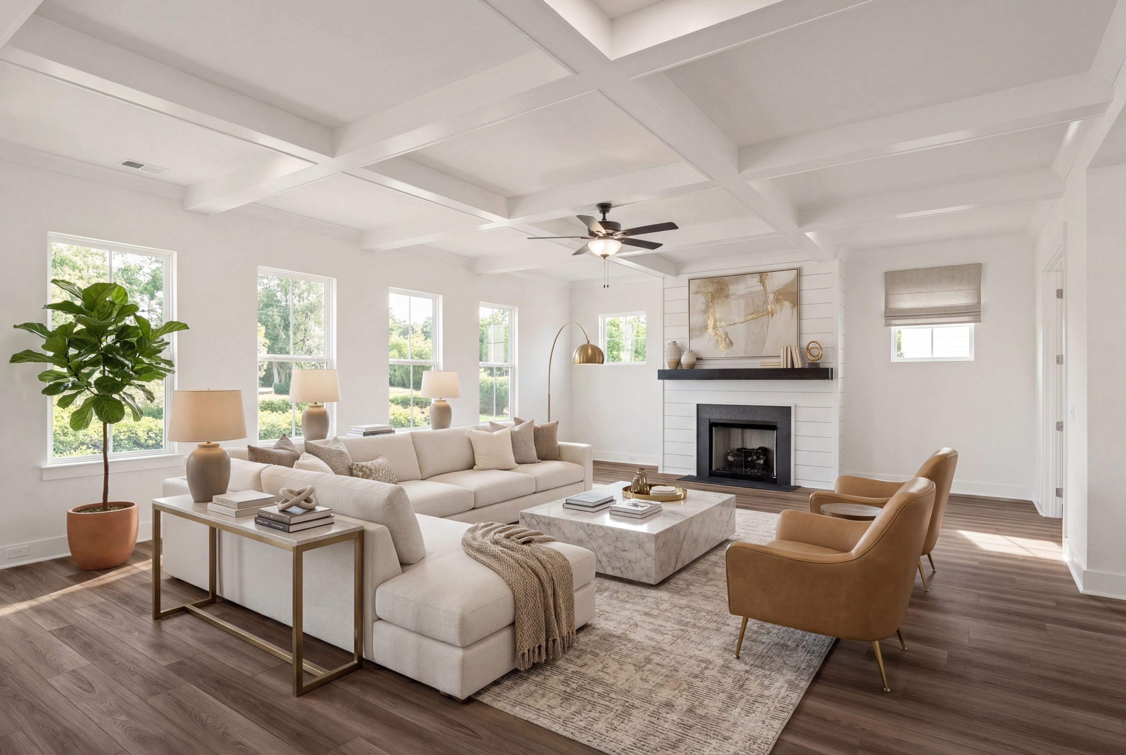 Modern open-concept living room in Shelton Square Murfreesboro TN with white sectional sofa, coffered ceiling, hardwood floors, and gas fireplace
