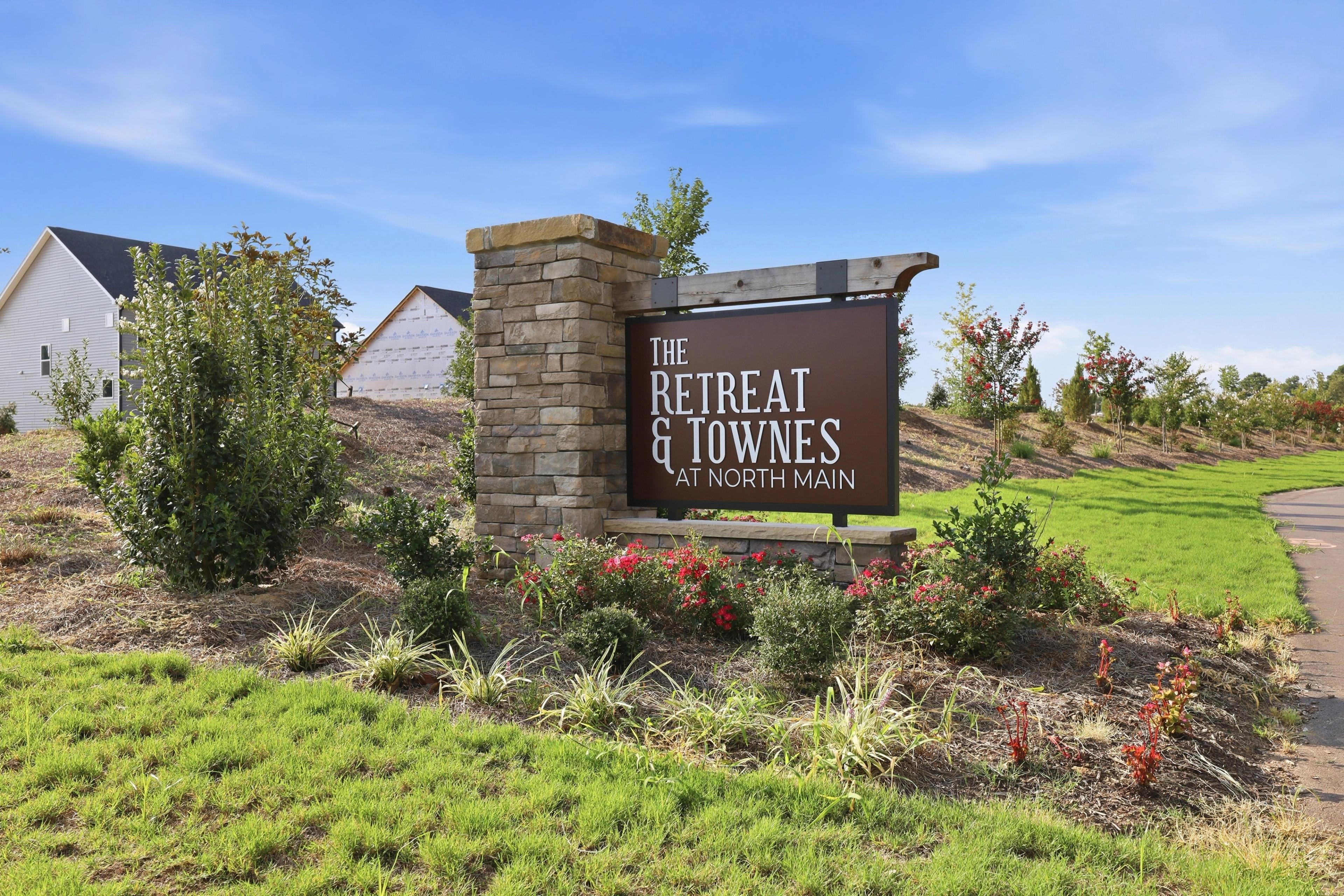 The Retreat & Townes at North Main community entrance sign in Lillington, NC, built by Davidson Homes.