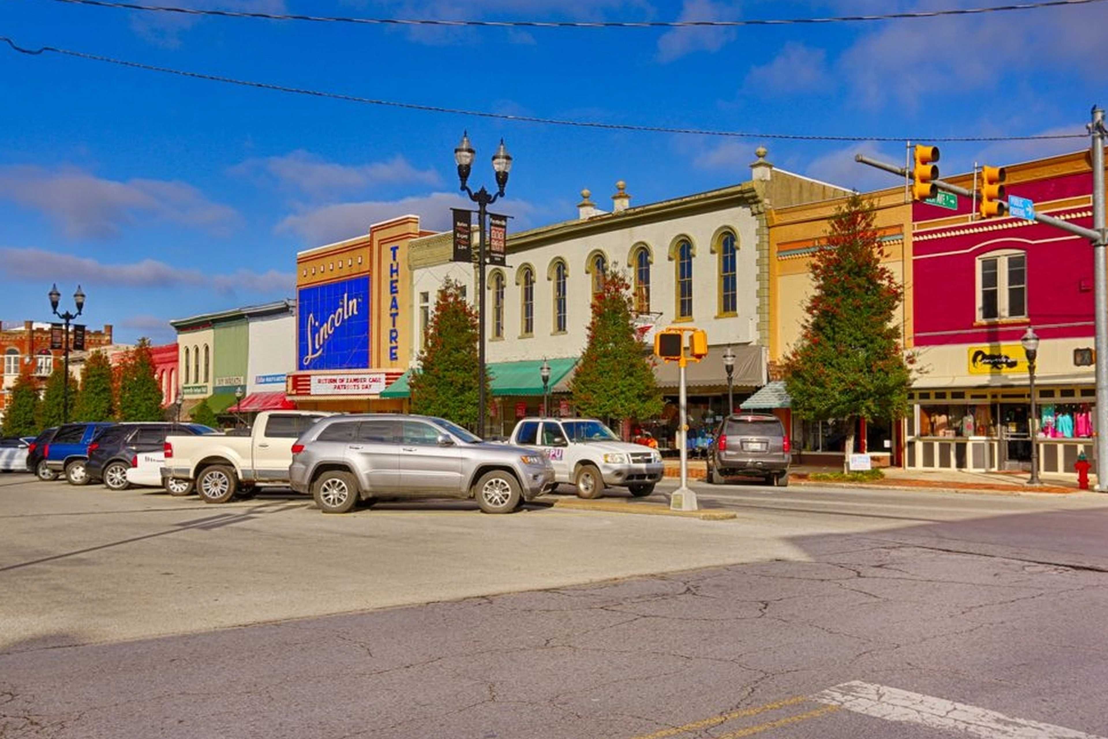 Charming historic downtown Fayetteville Tennessee near Bailey Park with colorful brick buildings, shops, and parked cars
