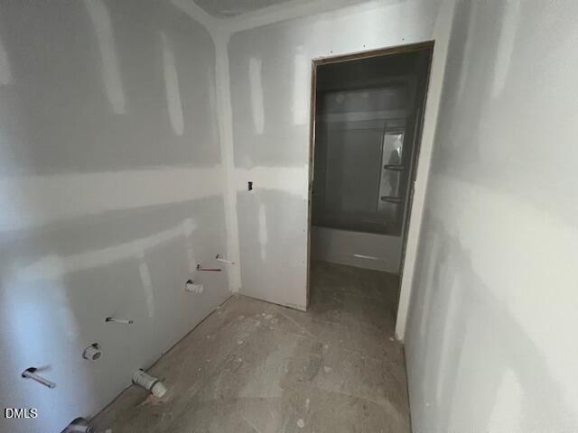 Unfinished bathroom under construction with drywall and tub plumbing in Davidson Homes The Ash C plan, Lillington, NC