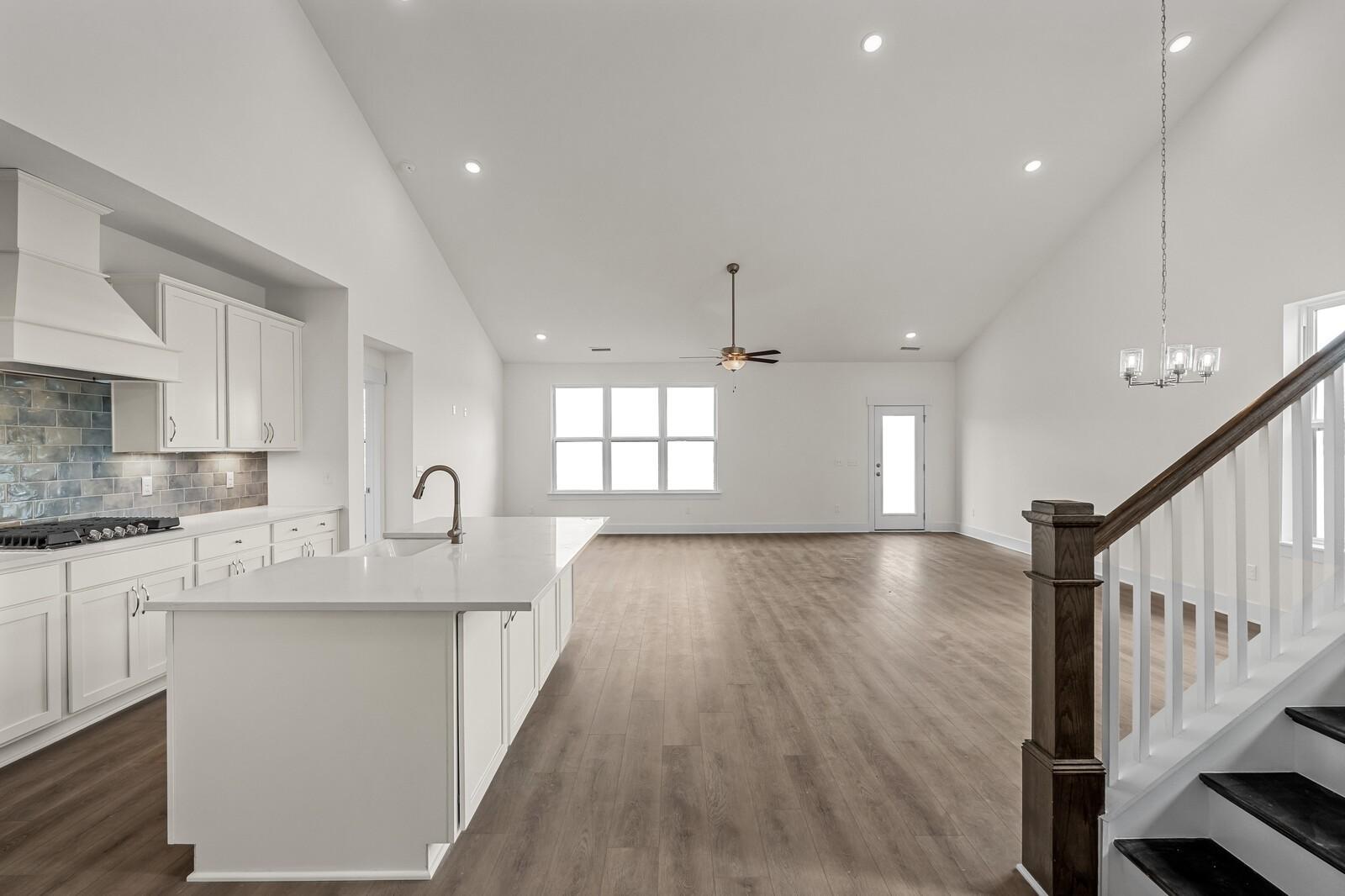 Open-concept kitchen and living area with vaulted ceilings in The Ridgeport D floor plan, Benders Cove, Mt. Juliet, TN.