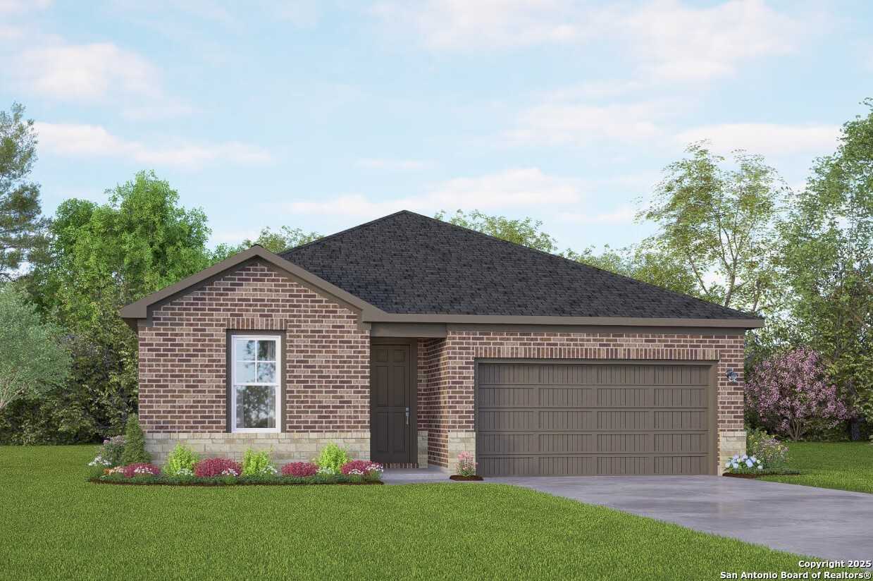 Modern single-story brick home with 2-car garage, front door, and landscaped yard in Bricewood, San Antonio, Texas - Davidson Homes The Asheville K