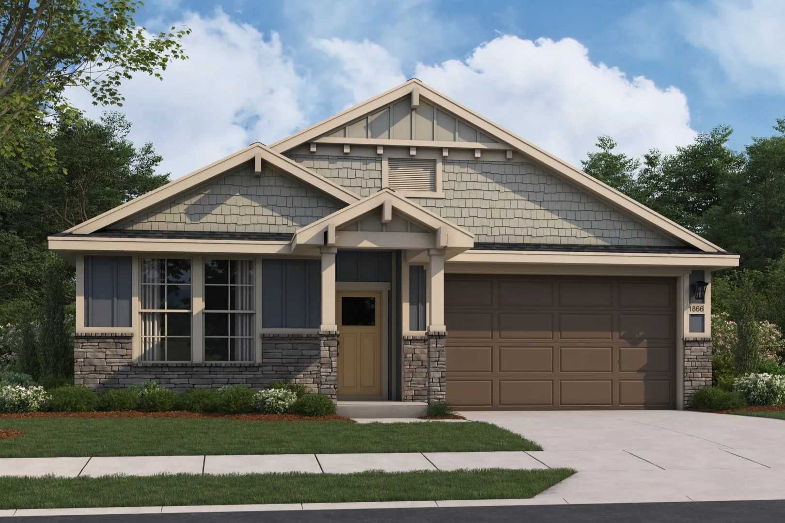 Craftsman-style elevation of The Aurora B single-story home featuring stone accents, shake shingles, two-car garage, and front porch landscaping