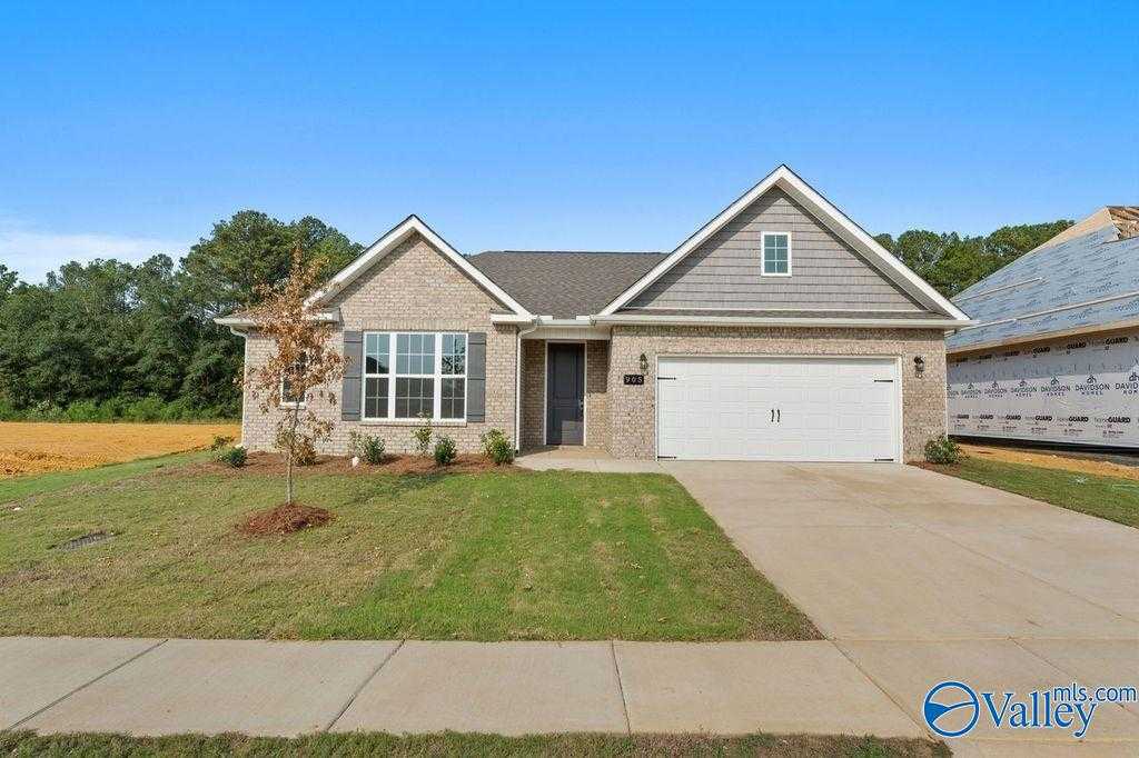 Modern brick ranch home with 2-car garage, gabled roof, and landscaped yard in Cain Park, Hartselle, Alabama