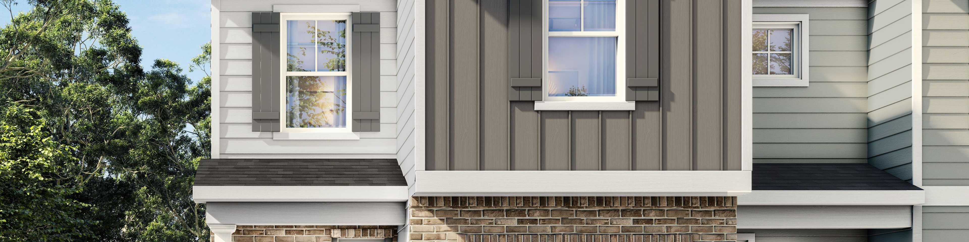 Modern farmhouse townhome exterior at Townes at North Main in Lillington, NC by Davidson Homes with a brick and siding facade.