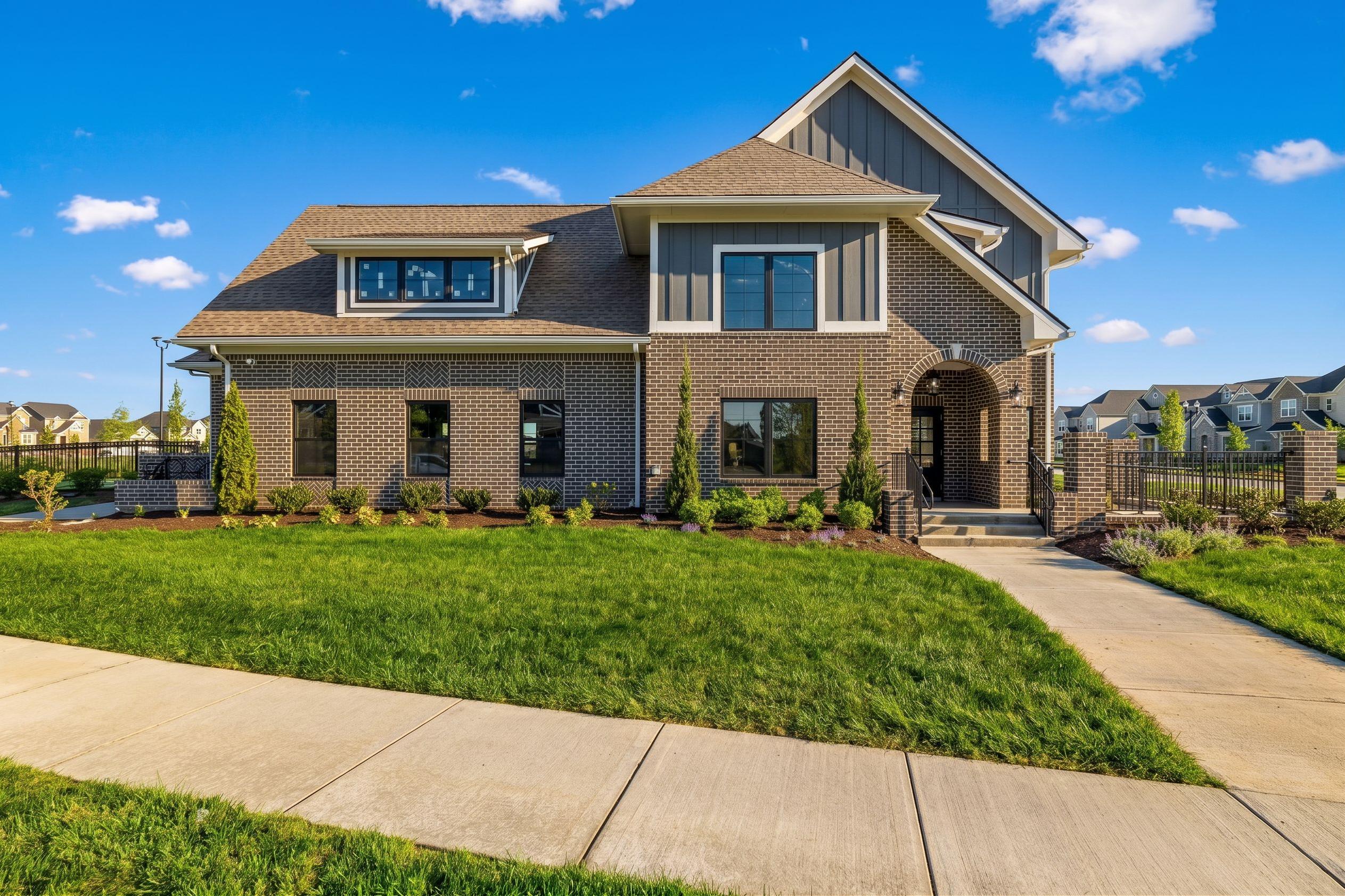 Davidson Homes exterior at Bradshaw Farms in Mt. Juliet, Tennessee featuring brick facade and arched entryway.