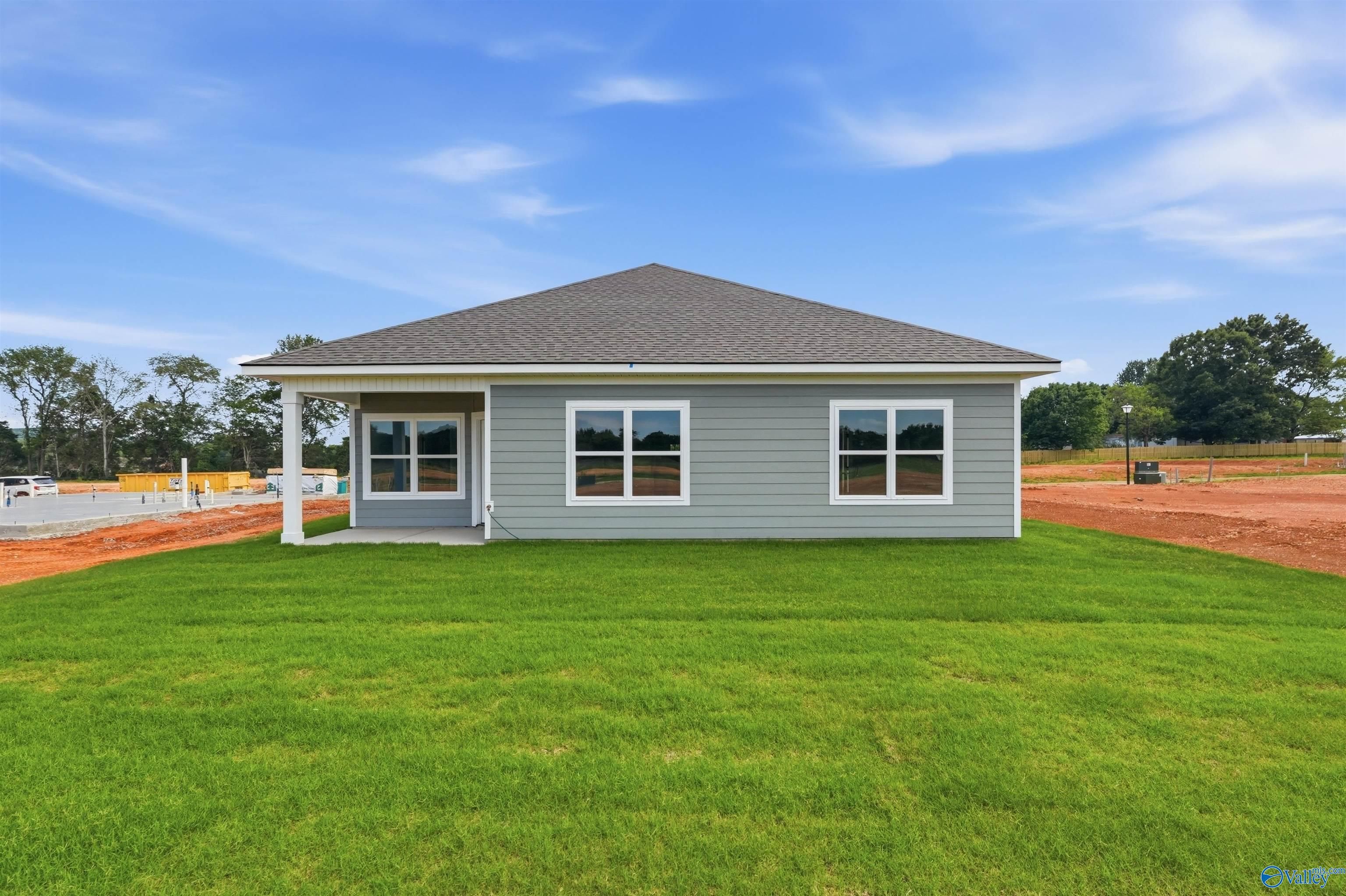 Gray siding exterior of The Daphne F floor plan by Davidson Homes in Berry Cove, New Market, Alabama.