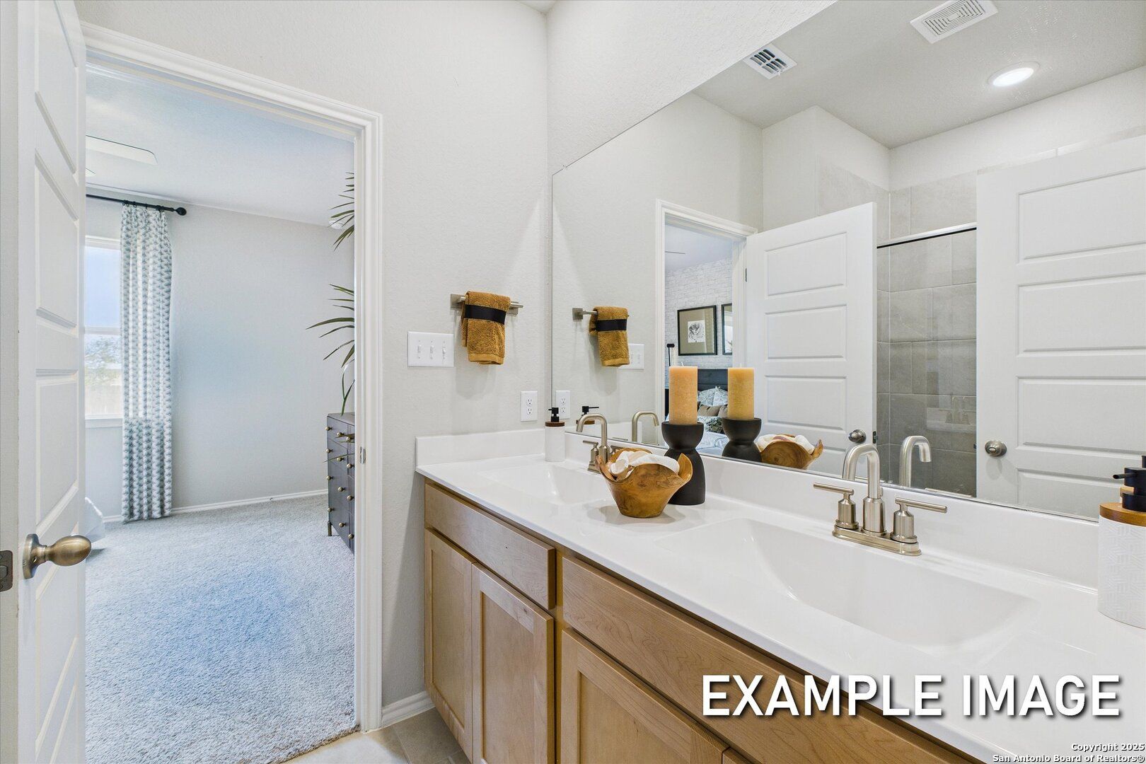 Modern master bathroom with oak double vanity, large mirror, walk-in shower in Davidson Homes The Sabine C, San Antonio