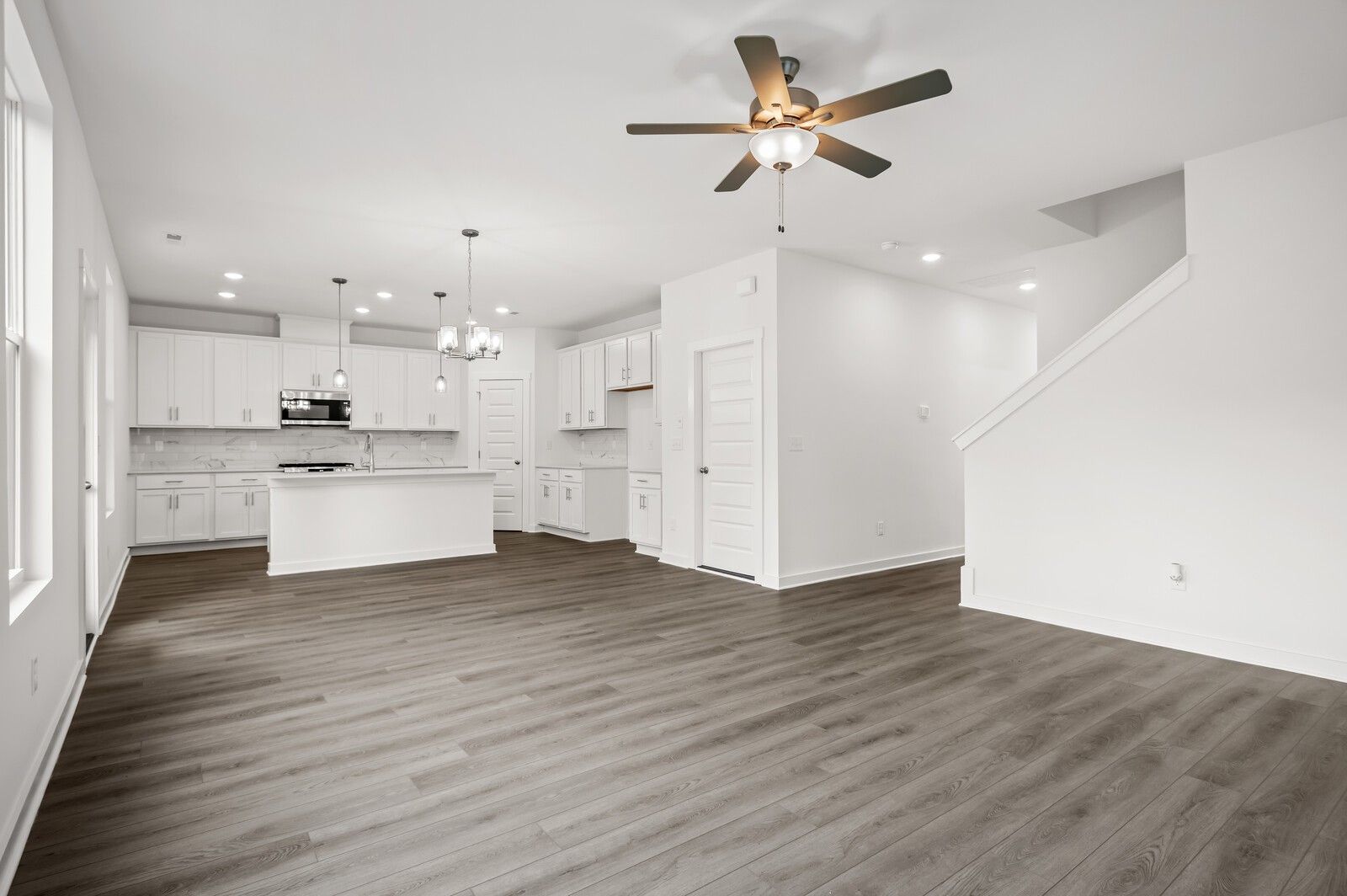 Open-concept living room and kitchen in The Logan C floor plan at Calista Farms, White House, Tennessee.