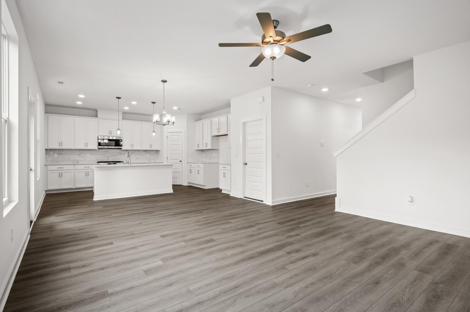 Open-concept living room and kitchen in The Logan C floor plan at Calista Farms, White House, Tennessee.