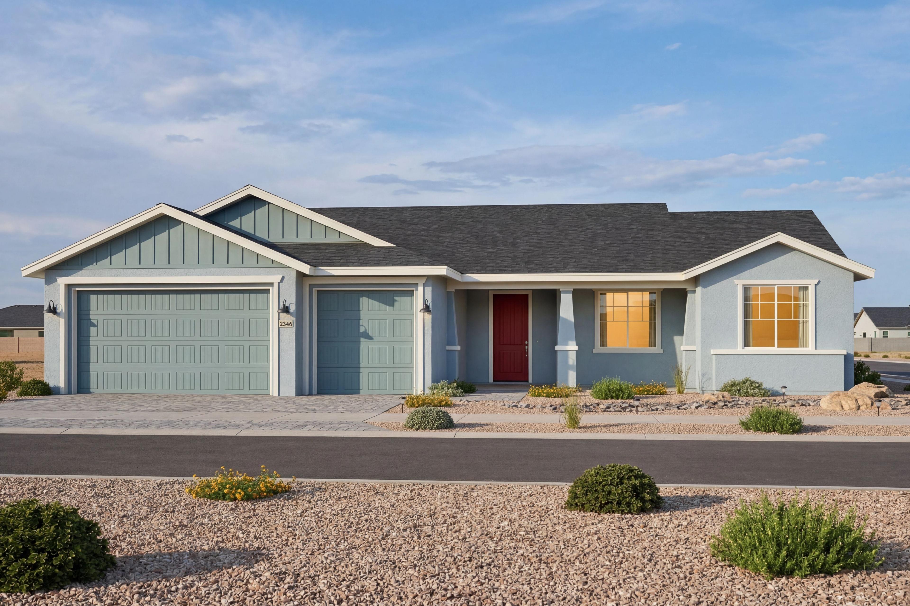 The Monarch B 1-story single-family home in Prescott Valley featuring a 3-car garage and vibrant red front door.