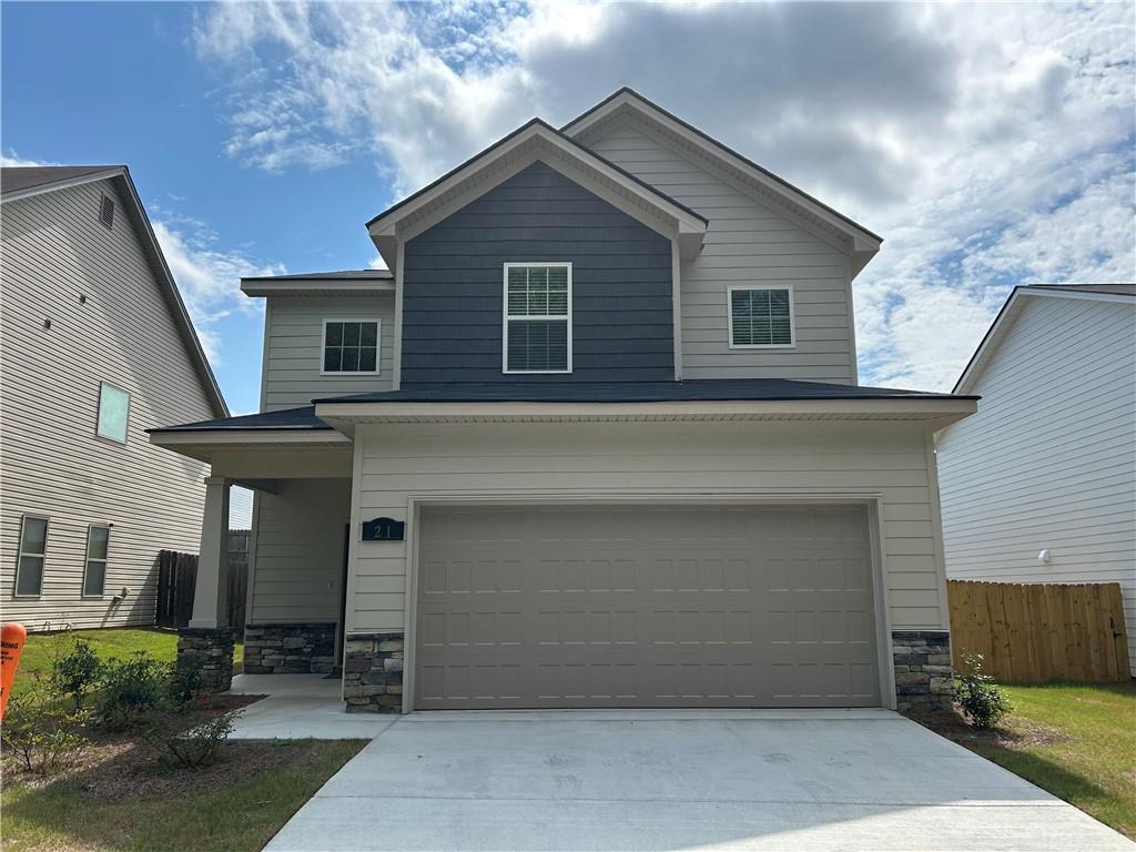 Modern two-story gray home with 2-car garage, stone accents, and driveway in Summer Vineyard, Phenix City, Alabama - Davidson Homes The Bartlett