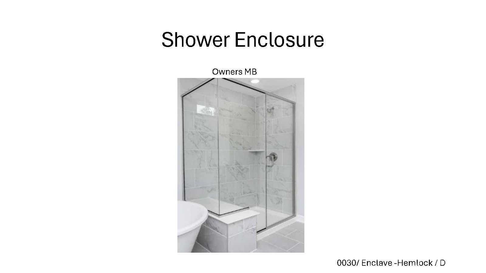 Glass-enclosed shower with tile surround in owners' bath of The Hemlock D home at Enclave at Belmont, Belmont, North Carolina.