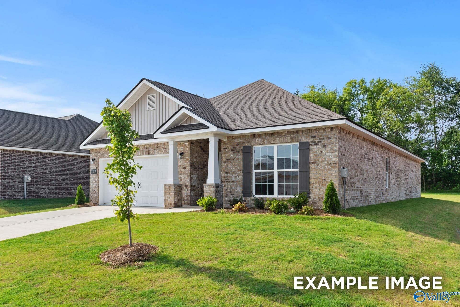 Modern single-story brick home with gabled roof, 2-car garage, and columned porch in The Highlands, Arab, Alabama - Davidson Homes The Daphne C