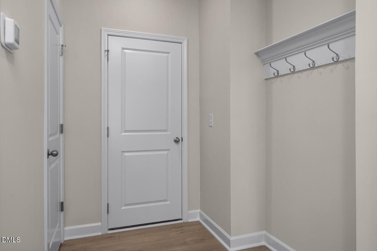 Mudroom entrance with coat hooks in The Mitchell interior floor plan at Camden Park, Knightdale, NC by Davidson Homes.