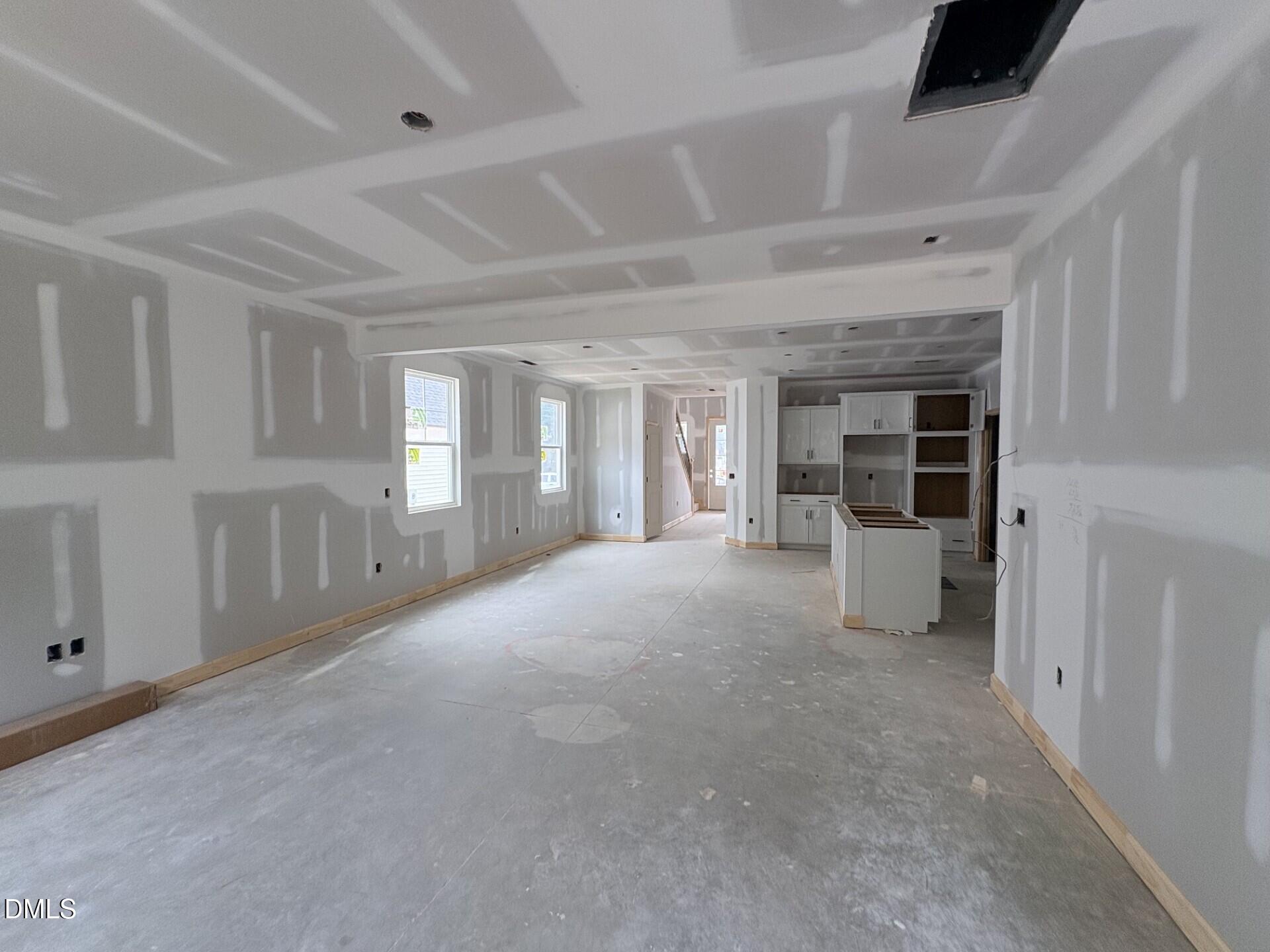 Open-concept interior under construction in The Adalynn A floor plan at Woodland Crossing, Zebulon, North Carolina.