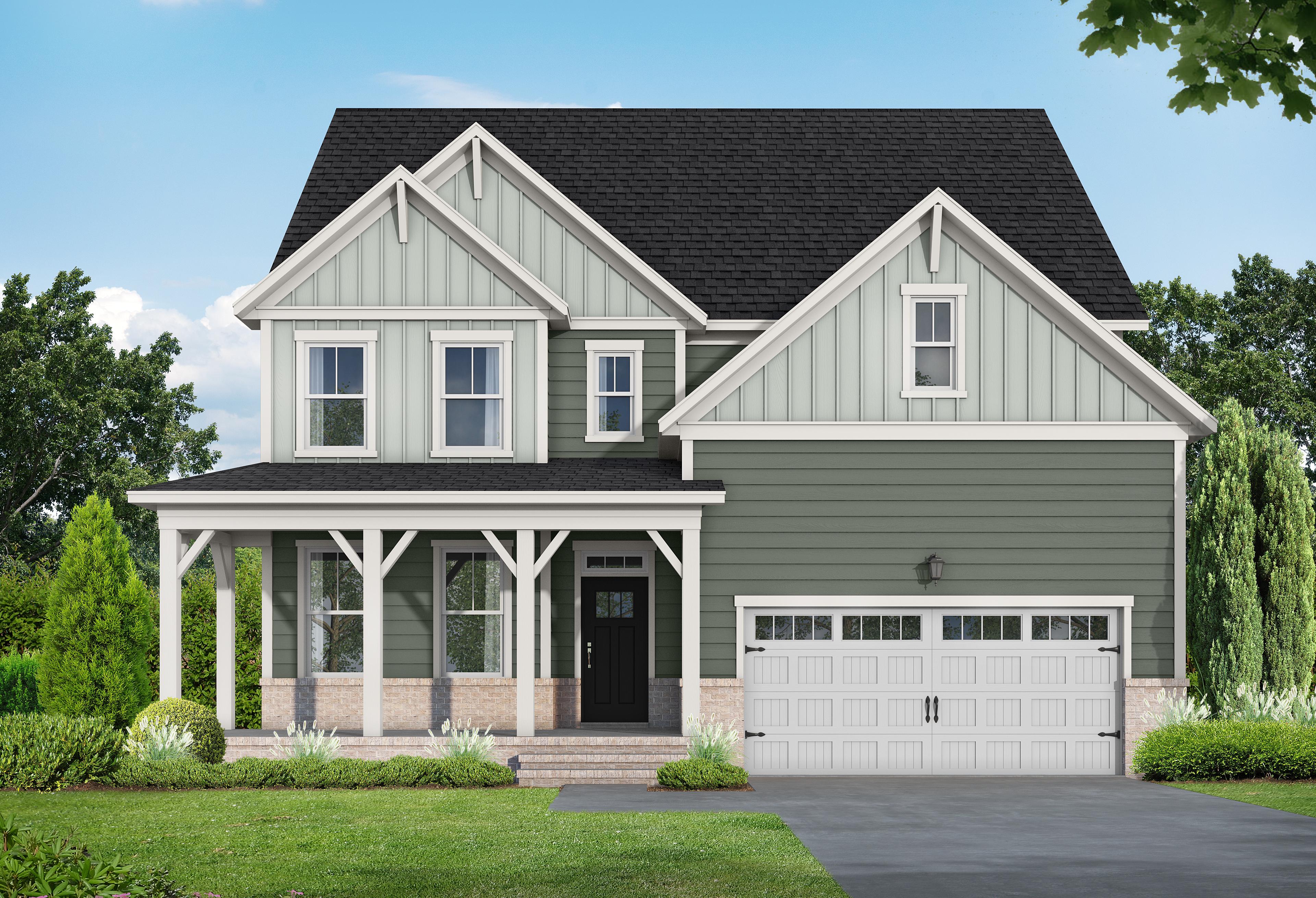 Two-story Hickory II E home in Wake Forest NC by Davidson Homes, sage green siding, brick accents, covered porch, 2-car garage