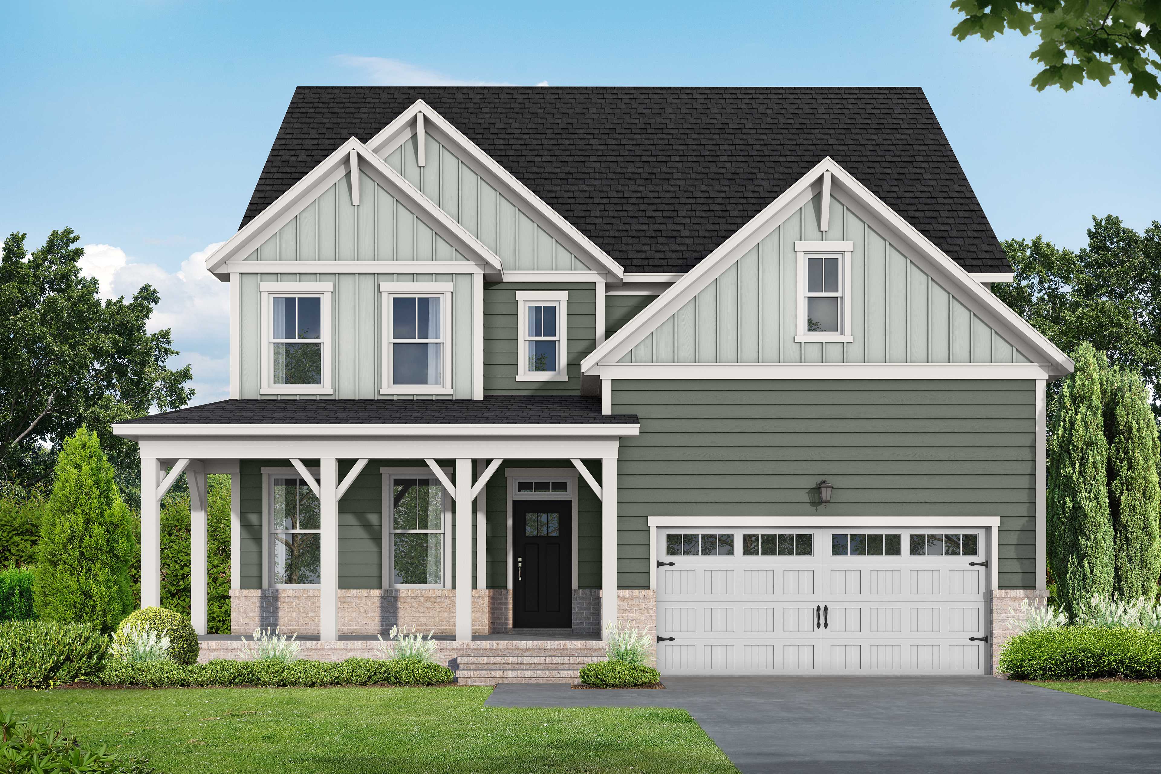 Two-story Hickory II E home in Wake Forest NC by Davidson Homes, sage green siding, brick accents, covered porch, 2-car garage