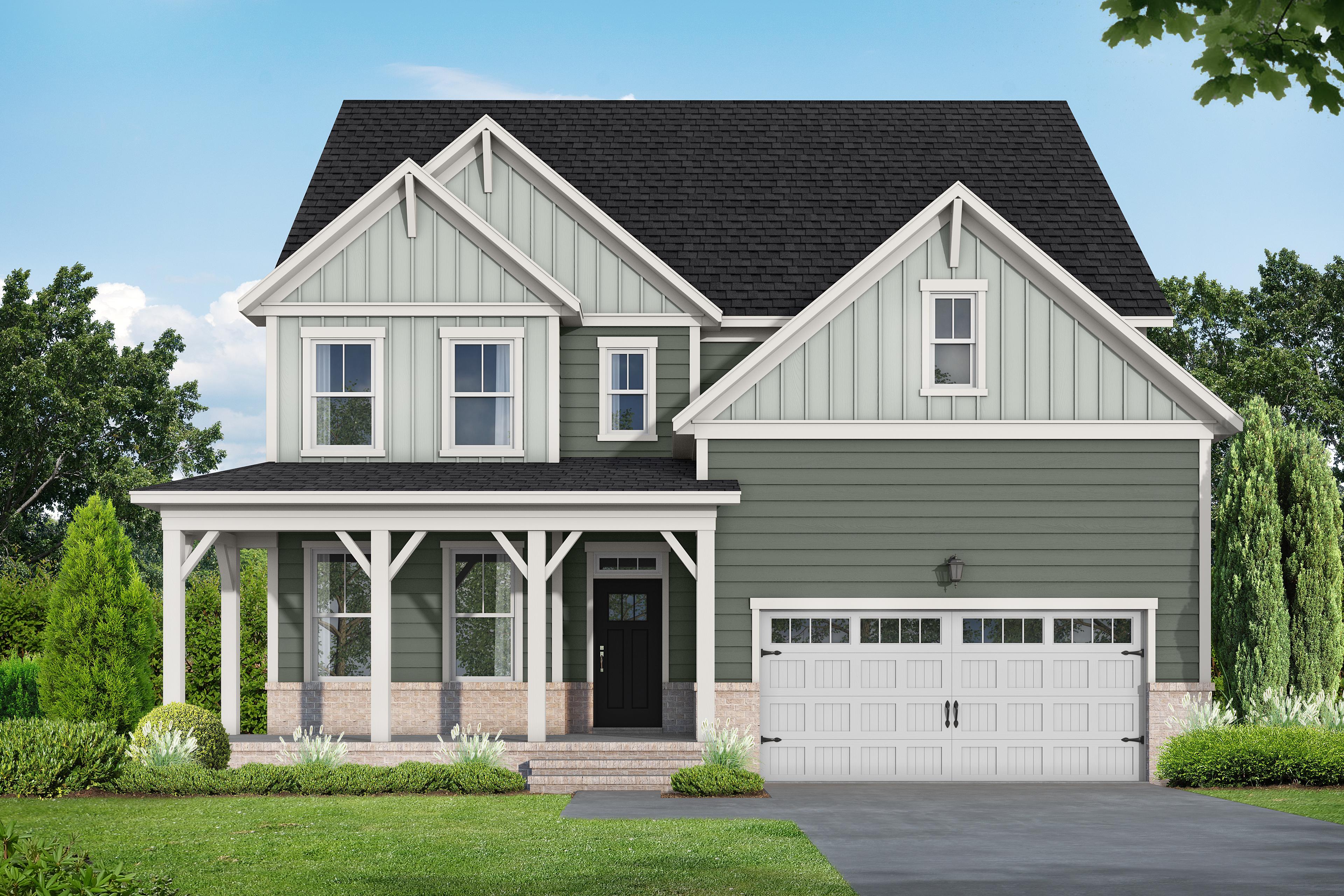Two-story Hickory II E home in Wake Forest NC by Davidson Homes, sage green siding, brick accents, covered porch, 2-car garage