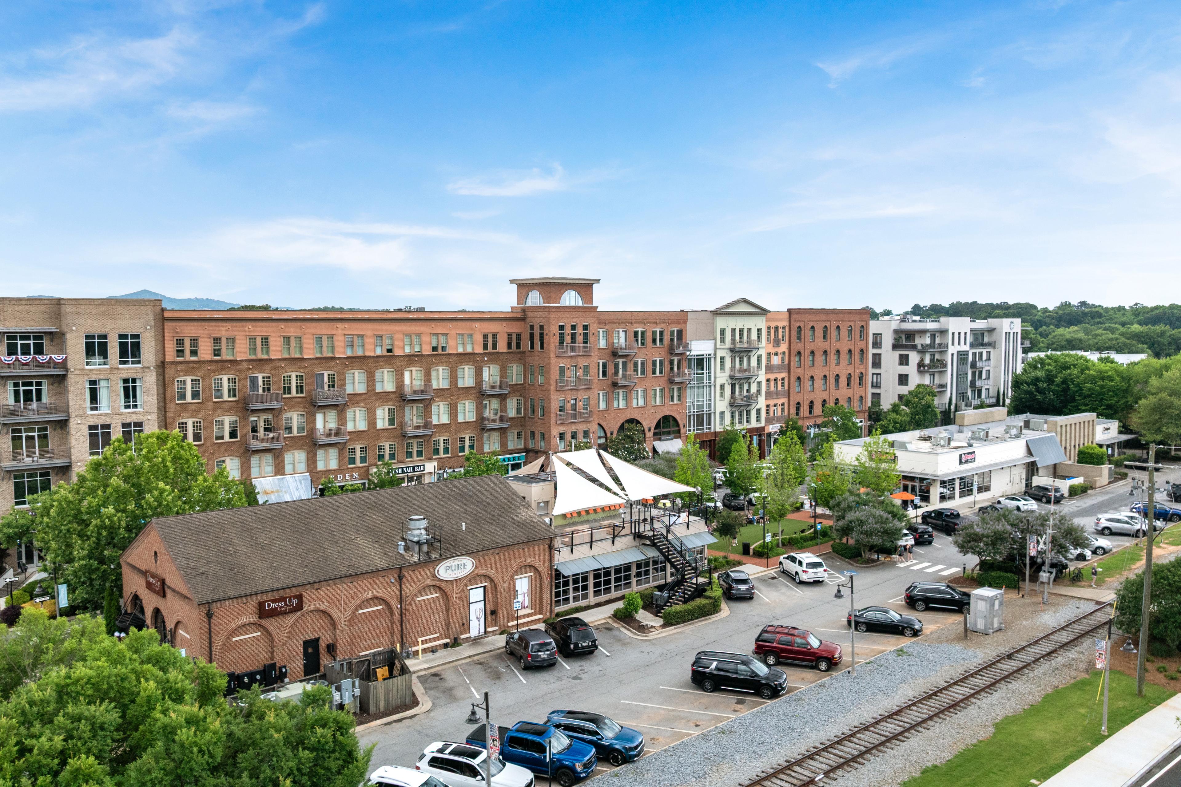 Aerial view of downtown Woodstock, Georgia near Grafton Trace by Davidson Homes featuring local shops and restaurants.