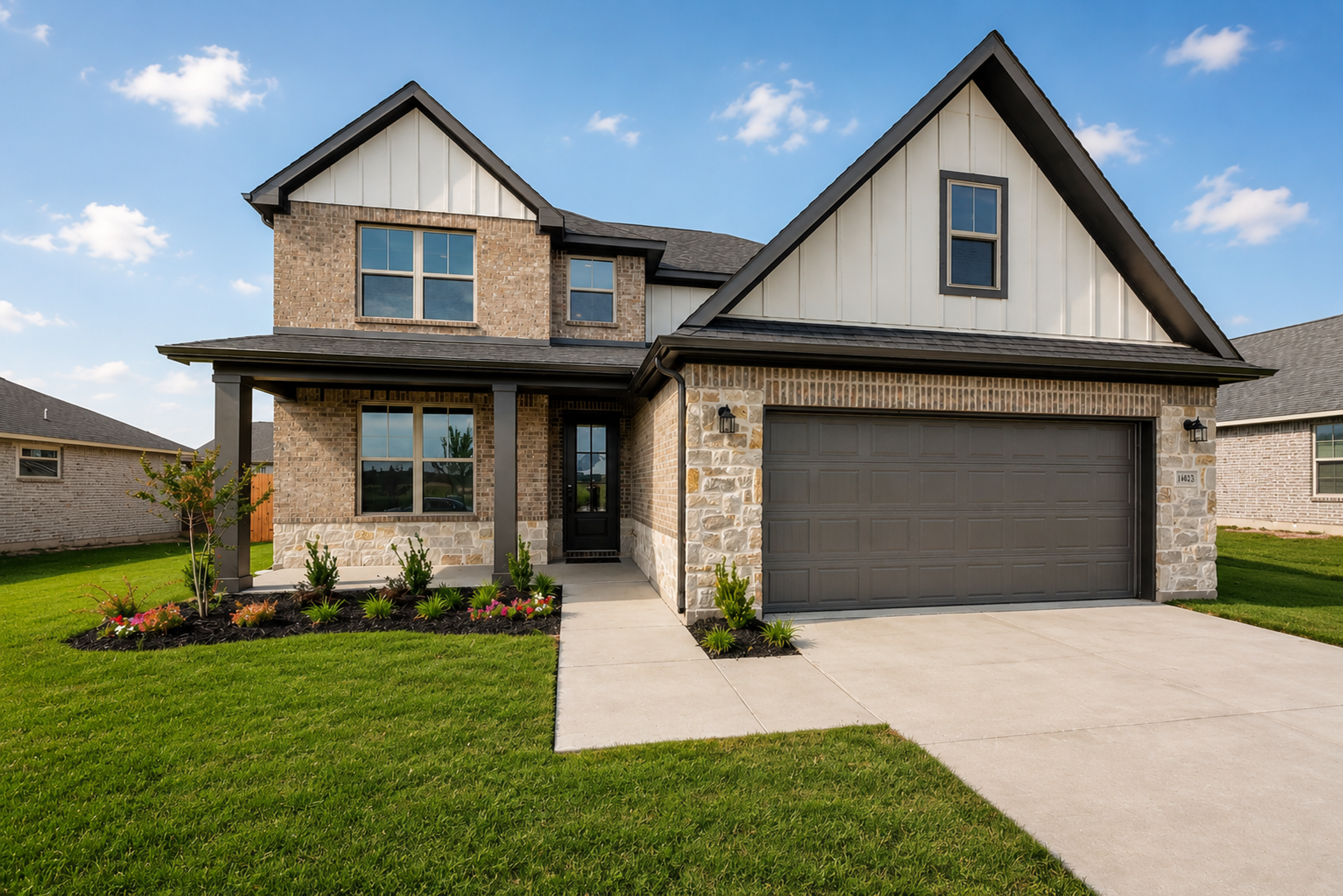 Modern brick and stone farmhouse exterior by Davidson Homes at Meadow Ridge Estates in Josephine, Texas