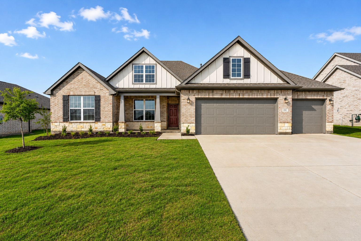 Open-concept kitchen at Waverly Estates in Josephine TX with white shaker cabinets, quartz counters, subway tile backsplash, hardwood floors, and dining area