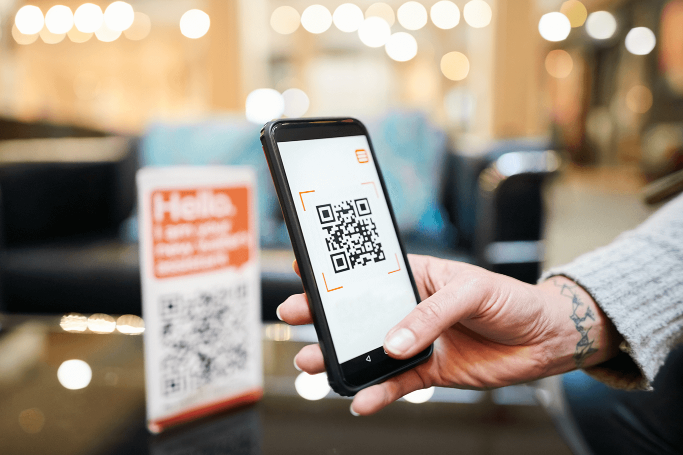 Person using a smartphone to scan a QR code for QR code ordering - enterprise POS system - SkyTab