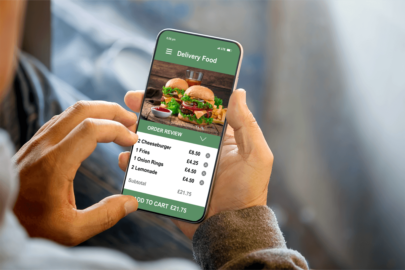 Person holding a smartphone showing a burger order delivery screen - quick service POS system - SkyTab