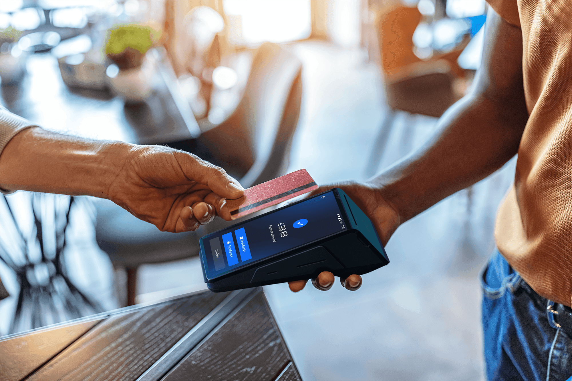 customer paying with their credit card on a SkyTab mobile POS device - POS pricing - SkyTab