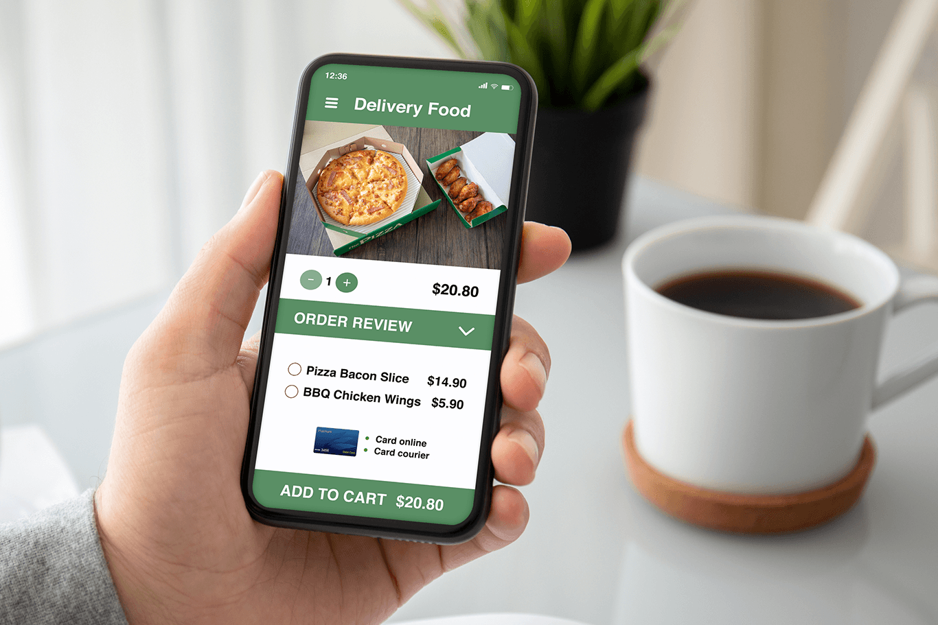 Man holding a phone showing a screen of an online order for pizza and wings - pizza POS system - SkyTab