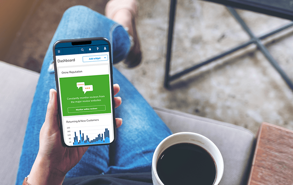 Person looking at the Shift4 Dine Customer Hub dashboard on their smartphone - loyalty and marketing - Shift4 Dine