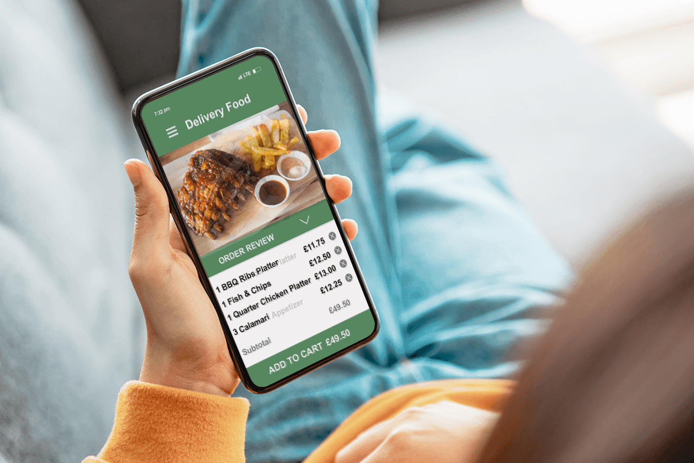 Person holding a smartphone showing a food delivery order - full service POS system - Shift4 Dine