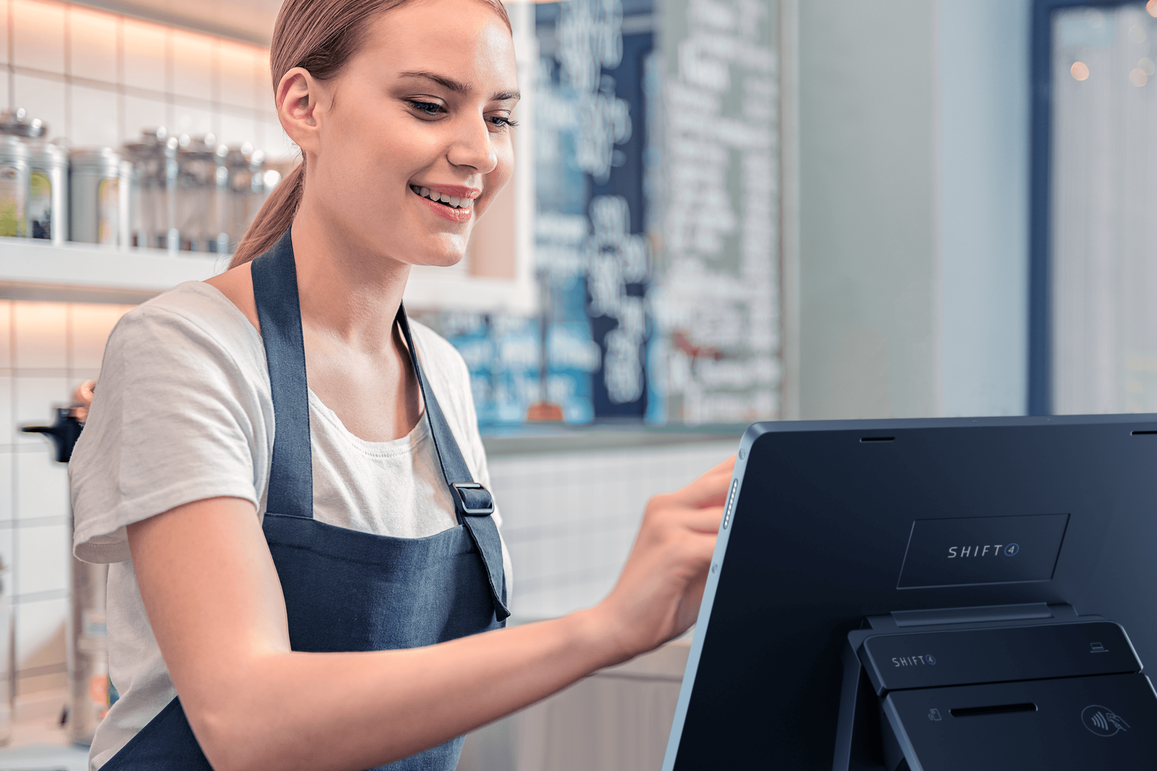Restaurant employee using a Shift4 Dine POS system - POS back office - Shift4 Dine