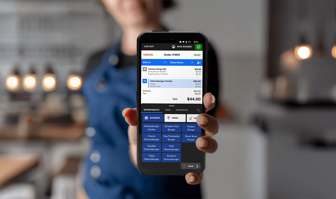Restaurant staff holding a Handheld POS device - handheld pos system - Shift4 Dine